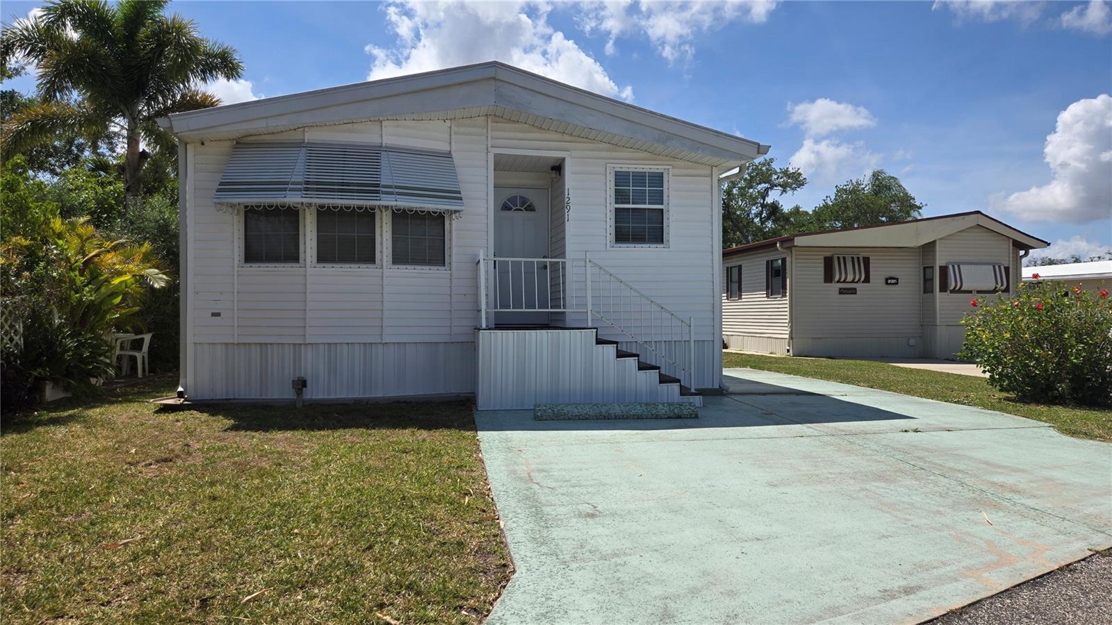 Welcome to easy Florida living in the desirable Sugar Creek Country Club Co-op community! This very clean, well-maintained canal-front home offers a peaceful waterfront setting with the kind of care and pride of ownership that’s hard to find. Step inside to a bright and inviting interior that has been meticulously kept, creating a move-in-ready opportunity for seasonal or year-round living. The home’s canal-front location provides a serene backdrop, perfect for relaxing mornings, enjoying nature, or unwinding at the end of the day. Sugar Creek is a friendly, active 55+ community known for its affordability and amenities, including a clubhouse, pool, shuffleboard, and a full calendar of social activities. Conveniently located near shopping, dining, medical facilities, and just a short drive to the beautiful Gulf beaches. If you’re looking for a low-maintenance home with waterfront charm and a welcoming community atmosphere, this one checks the boxes.