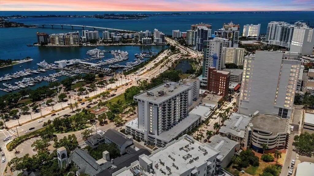 THE LOWEST priced 2/2  + OFFICE  in DOWNTOWN Sarasota!!!!! 1400 sq ft , Large Balcony with panoramic CITY VIEWS !!  REAL WOOD FLOORS THROUGHOUT . 
 THE 101 sits in the very heart of downtown directly across from MARINA JACK’S. An open-concept layout, and large windows offering abundant natural light. Enjoy the convenience of  downtown Sarasota, steps away from dining, shopping, and cultural attractions. Relax on the private balcony  or take advantage of the building’s full list of  amenities, including a fitness center, LIBRARY,  and YEAR-ROUND HEATED POOL .