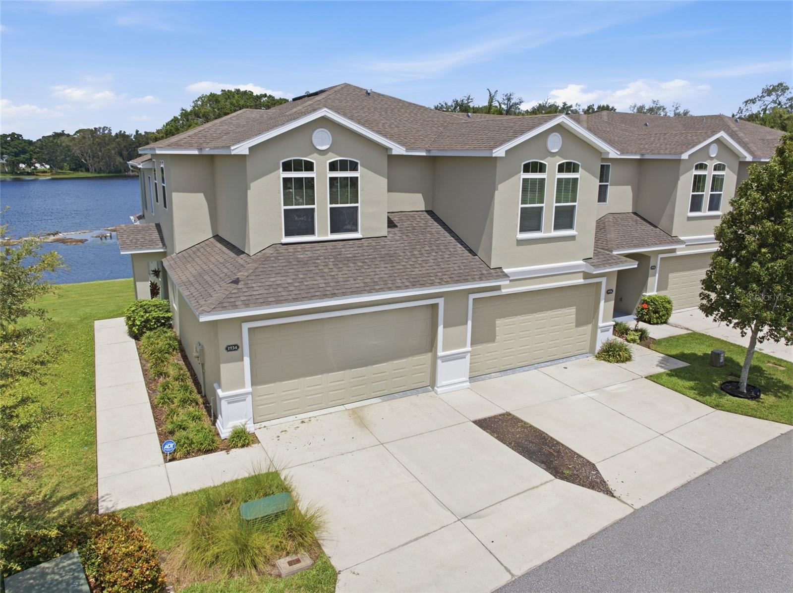 SELLER IS OFFERING $5,000 TOWARDS BUYERS CLOSING COSTS! Welcome to Clearwater, where everyday convenience meets the laid-back Gulf Coast lifestyle. 
Situated directly on Beckett Lake within the gated Montclair Lake Townhomes community, this beautifully updated and meticulously maintained end-unit townhome offers 4 bedrooms, 3.5 bathrooms, a 2-car garage, and nearly 2,300 square feet of living space. Stepping inside, wood-look tile flooring flows throughout the first-floor main living areas, complemented by soaring ceilings and dramatic two-story windows that fill the home with natural light while showcasing beautiful water views. The kitchen features quartz countertops with barstool seating, ample cabinetry complemented by a timeless subway tile backsplash, stainless steel appliances, and recessed lighting. A first-floor powder room is perfect for guests, while the laundry room offers added convenience with the washer and dryer included. 

The first-floor owner’s suite features a walk-in closet and an ensuite bathroom with dual sinks, a separate soaking tub, and a stand-up shower. Upstairs, the split-bedroom layout provides three additional generously sized bedrooms and two full bathrooms, providing functionality for all. Step through the sliding glass doors to the screened-in patio overlooking Beckett Lake, the perfect place to unwind and enjoy the peaceful waterfront setting. A brand-new AC system installed in 2026 provides added comfort and peace of mind.

Residents of Montclair Lake Townhomes enjoy low HOA fees that include high-speed internet, expanded cable, exterior maintenance and painting, roof replacement, landscaping, irrigation, pond care, a community pool, and strong escrow reserves. This lakefront home offers the space and comfort of a single-family residence with the ease of low-maintenance townhome living, all in one of Clearwater’s most convenient locations.

Ideally located near the Dunedin border, this home places you just minutes from the charm of Downtown Dunedin, known for its locally owned restaurants, breweries, boutiques, waterfront parks, seasonal festivals, and vibrant community events. Spend your weekends biking the scenic Pinellas Trail, exploring Hammock Park, catching a Toronto Blue Jays spring training game at TD Ballpark, or heading to the Dunedin Causeway, Honeymoon Island, and world-famous Clearwater Beach for a day on the water. Countryside Mall, grocery stores, medical facilities, shopping, dining, and everyday essentials are all close by. With convenient access to US-19, commuting to St. Petersburg, Tampa, area airports, and the rest of Tampa Bay is a breeze. This home is sure to check all of your boxes, schedule your showing today!