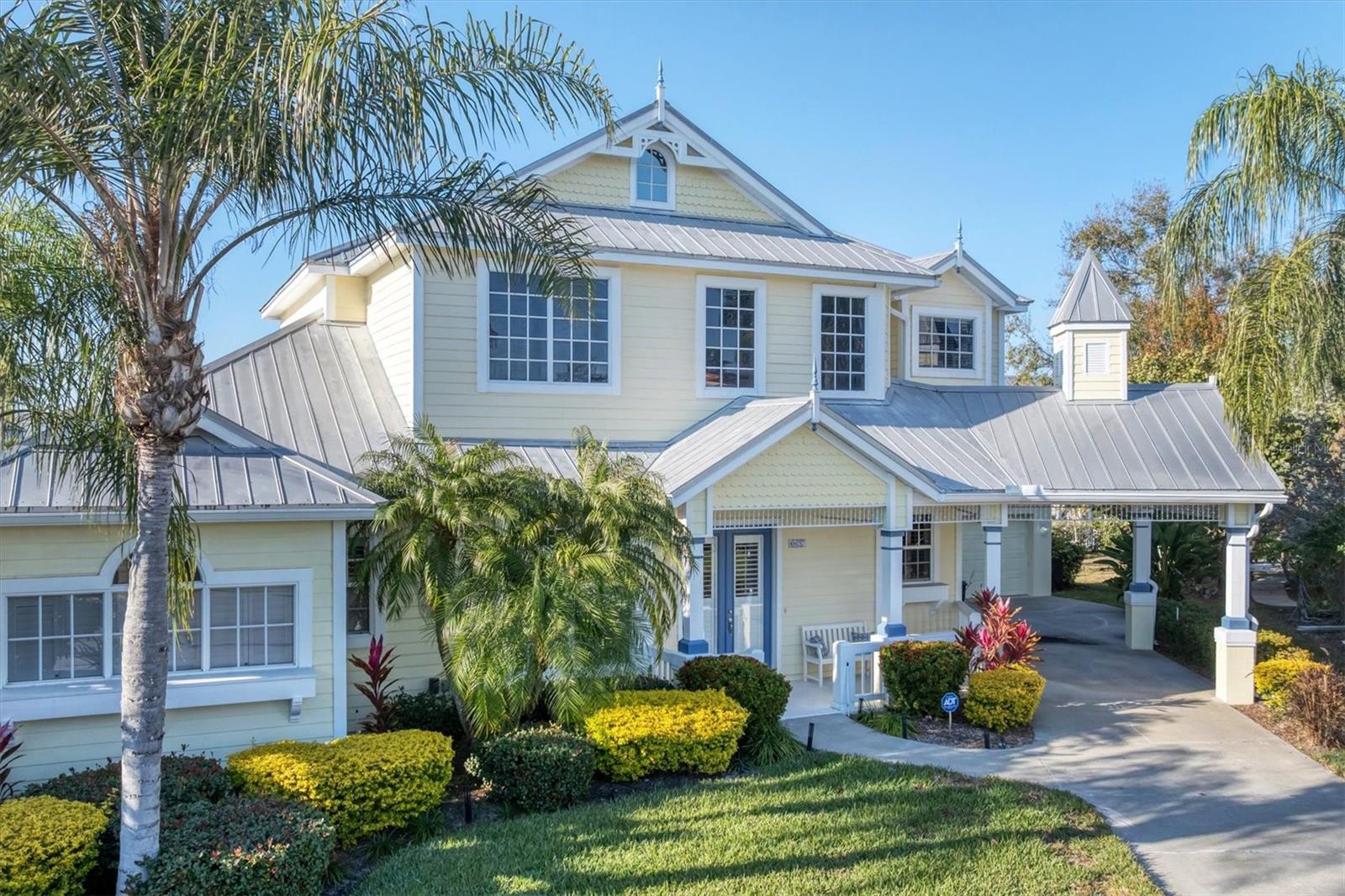 Step into a piece of music history with this stunning Key West-style retreat, formerly the private residence of Graeme Edge, legendary drummer and founding member of the Moody Blues!  Nestled on a deep-water, 123 foot canal boasting direct access to the Manatee River, this estate offers a lifestyle that is both soulful and sophisticated.  Situated at the end of a cul-de-sac street, this home's classic Key West aesthetic is highlighted by a durable metal roof and expansive, very open living space totaling just under 3100 square feet.  At the heart of the home, a beautifully remodeled chef's kitchen with double oven serves as the perfect centerpiece for entertaining.  With four spacious bedrooms and 3.5 baths, there is ample room for family and guests.  The primary bedroom is on the first floor and the upstairs features a 15'x28' loft with adjacent bedrooms.  A downstairs bonus/game room makes this house beyond perfect for entertaining and leisure.  Outside, your private tropical oasis awaits featuring an outdoor shower, and a sparkling heated pool/spa overlooking the water.  Hop on your boat for a sunset cruise on the Manatee River or simply enjoy the peace and serenity of the waters.  Recently painted in wonderful soft colors, this home truly has it all.  Whether you are a boating enthusiast or a seeker of serene sunsets, this home is a "Nights in White Satin" dream come true.  This home is in an very low HOA community and NO CDD!!!!!  Schedule your showing today!