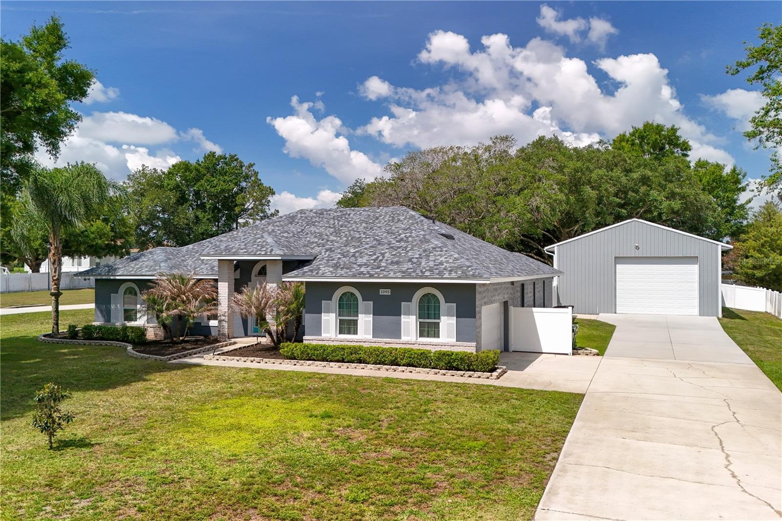 Welcome to this exceptional 4-bedroom, 3-bath home set on over half an acre, offering a rare combination of space, privacy, and versatility, complete with a heated swimming pool, screened-in patio, and an impressive 32x48 insulated and air-conditioned workshop.
From the moment you arrive, you’ll appreciate the curb appeal with a well-maintained exterior, extended driveway, and ample parking leading to the detached workshop — ideal for multiple vehicles, equipment, or recreational toys.
Inside, the home offers a bright and functional layout with tasteful finishes throughout. The kitchen is both stylish and practical, featuring warm wood cabinetry, granite countertops, stainless steel appliances, and plenty of counter space — perfect for everyday living and entertaining. The open flow provides easy access to dining and living areas, creating a welcoming environment for family and guests.
The primary bathroom is a true retreat, showcasing a spa-like design with a freestanding soaking tub, separate walk-in shower, dual vanities, and modern finishes — offering both comfort and elegance.
Step outside and enjoy your private backyard oasis, complete with a heated swimming pool and screened-in patio — ideal for year-round relaxation, bug-free outdoor living, and entertaining. The expansive lot provides plenty of room for additional outdoor activities, storage, or future possibilities.
A standout feature is the 32x48 insulated and air-conditioned metal workshop, complete with its own half bathroom, offering endless possibilities for a home business, workshop, vehicle storage, or hobby space. This fully climate-controlled building is a rare find and adds tremendous value and functionality.
In addition, the property includes a fully insulated and air-conditioned detached flex space, perfect for a home office, gym, studio, or private retreat — giving you even more versatility to fit your lifestyle.
With a rare combination of indoor comfort, outdoor enjoyment, and multiple climate-controlled structures, this property is ideal for those seeking space, functionality, and flexibility.