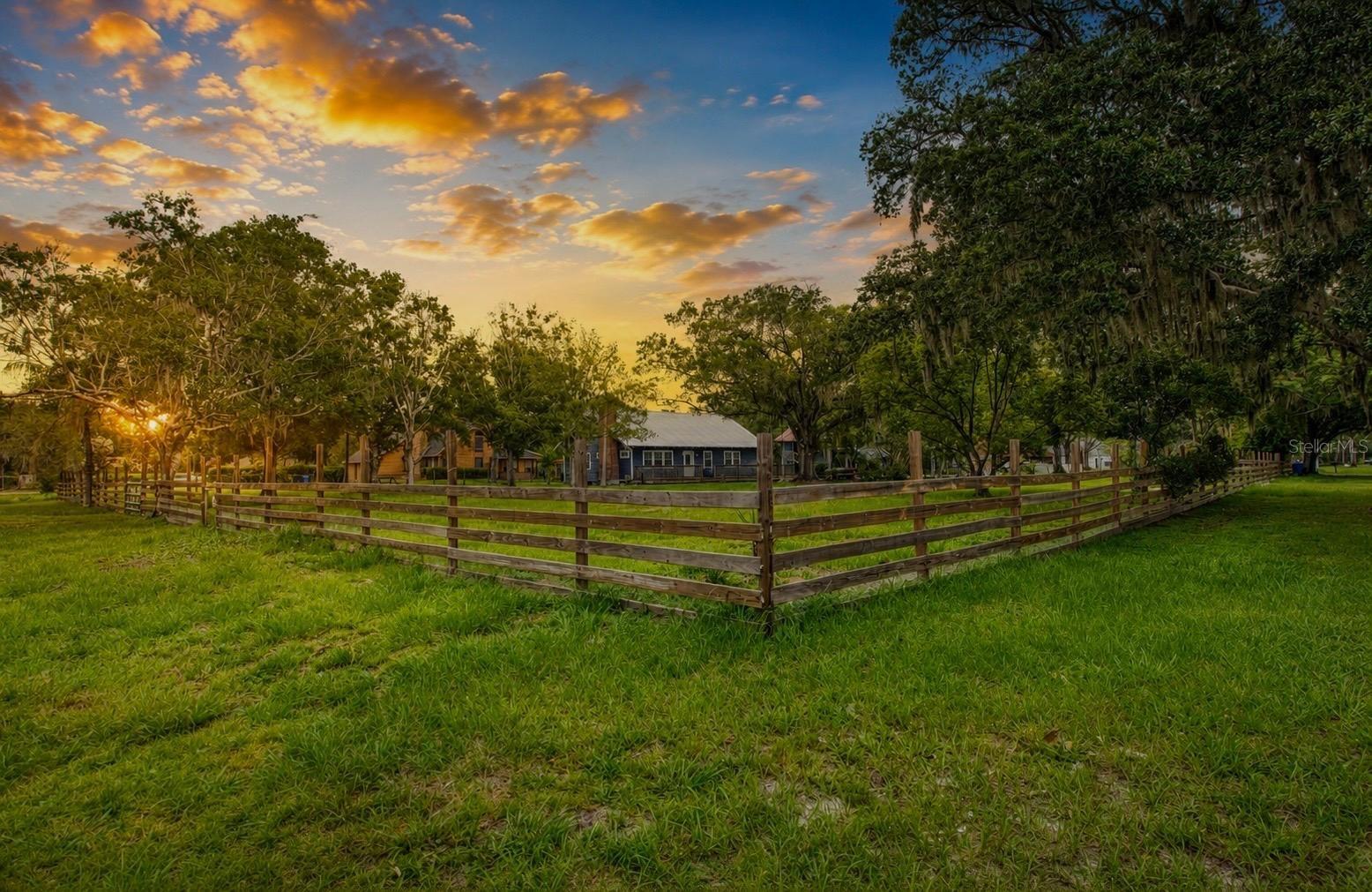 Welcome to your Florida oasis in the heart of Lutz.  A truly unique find, situated on 1.15 fenced acres with no deed restrictions, no HOA & not in a flood zone.  This beautiful property offers the freedom of country living with high & dry land for gardening, outdoor activities, amazing yard for the kids and all your pets & still plenty of room for an Rv, boat & work truck.  Zoned for TOP RATED SCHOOLS, Lutz K-8 and Steinbrenner High School.  This Florida Farmhouse features 3 Bedrooms, 3 full bathrooms with a spacious bonus room/loft that could easily be used as a 4th bedroom if needed.  The home was redone in 2014; including new electrical, plumbing, drywall, siding, Trek decking, flooring, kitchen & bathrooms- with a certificate of occupancy issued from Hillsborough County. Durable Aluminum roof approx 2007 and top of the line water filtration system included.  Inside you'll find gorgeous porcelain tile running throughout the great room and kitchen and a beautiful wood burning fireplace.  The kitchen is a chef's dream with double ovens, a farmhouse sink with goose neck faucet, granite countertops, wood cabinetry & stainless-steel appliances. You'll find the master suite on the main floor, along with another bedroom and 2 bathrooms. The master bathroom has a jetted tub with shower. Upstairs is an open loft/bonus room with a full bathroom and the 3rd bedroom.  The 3rd bedroom & hallway use to be a storage area that has been opened up, wouldn't take too much work to finish it. Bring those same handyman skills over to the 2-story storage building, this structure has storage downstairs and a 400 square feet, 1 bedroom/ 1 bath APARTMENT upstairs!  There's also another, separate 18x20 garage. The two outbuildings need repairs/updated, but with some handyman skills you could return these structures back to their original glory!  Easy access to US 41, Dale Mabry, Expressway & 275.  Local shopping & restaurants are super convenient.  Come sit under the shaded oak tree's, amongst the wildly growing lilies, smell the jasmine crawling along the fence line... get back to nature, all the country charm you've been looking for is right here by your very own windmill.  Give me a call for your private showing today.