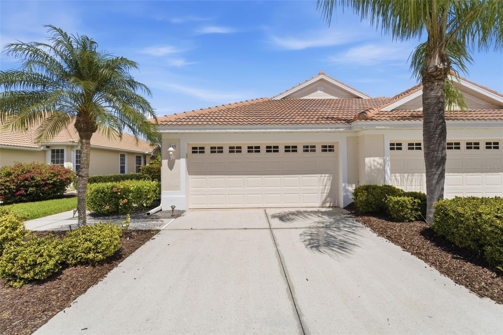Set on a quiet lake with fountain views, this turnkey-furnished paired villa offers a rare combination of privacy, flexibility, and low-maintenance living within one of North Port’s most sought-after gated communities. The Hemingway floor plan spans just under 1,700 square feet, with 2 bedrooms, 2 baths, and a flexible den that easily functions as a third bedroom or office—giving you options without wasted space. Inside, the home is designed to feel open, comfortable, and easy to live in. Tray ceilings, crown molding, engineered hardwood flooring, and custom window treatments create a polished, cohesive look throughout. The kitchen is both functional and inviting, featuring maple cabinetry, solid surface countertops, natural gas cooking, and a bright dinette for casual dining. Where this home truly stands apart is in its connection to the outdoors. The main living area opens to an extended screened lanai with both covered and open sections, capturing long lake views and a quiet, private setting. Thoughtfully scaled for everyday use, the space is ideal for morning coffee, dining for two, or unwinding at the end of the day—without the upkeep of a larger outdoor area. The primary suite offers direct lanai access, a walk-in closet, and a spacious bath with dual vanities, soaking tub, and walk-in shower. Guest accommodations are thoughtfully separated for privacy, while the den provides the flexibility buyers are actively looking for today. A brand-new barrel tile roof (2025) adds immediate value and peace of mind—one of the most significant expenses already handled for the next owner. Ownership here is designed to be simple. Located just a short golf cart ride from the clubhouse, fitness center, pool, and tennis complex, the HOA supports a true maintenance-free lifestyle, including exterior care, landscaping, irrigation, and bundled fiber optic services. Heron Creek offers 27 holes of Arthur Hills–designed golf, a 21,000-square-foot clubhouse, and an active, social environment. Country Club membership is required, with several options starting at $276/month. Conveniently located near I-75, Sarasota Memorial Hospital North Port, Wellen Park, Venice, and Gulf beaches, this home works equally well as a full-time residence, seasonal escape, or low-maintenance investment.