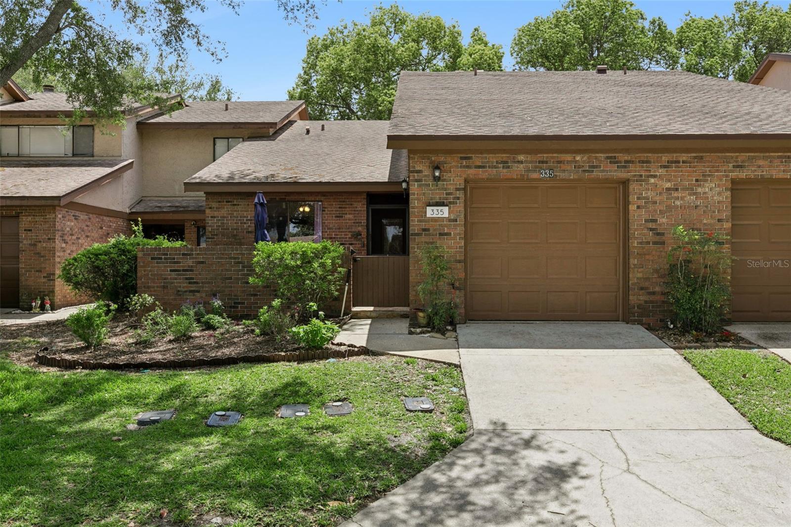 Welcome home to this beautiful 3 bed / 2 bath single story condo, across the street and steps away from a relaxing, community pool. Vaulted 16' ceilings with plenty of natural light, greet you with an open floor plan, providing a feeling of comfort and space. Private brick courtyard in the front. Updated kitchen counters in quartz and plenty of storage. Newer appliances including an induction cook top and a built-in air fryer in the oven! Wonderful wooden blinds decorate the back windows. Washer and Dryer included, located in the garage. An enclosed Sunroom extends living area; perfect for relaxing, reading or just enjoying the nature views. The Primary Bedroom has an Ensuite Bathroom and walk-in closet. The community features a pool, walking trails throughout Wekiva, 18-hole golf course nearby, clubhouse, playground, and tennis courts are available. Wekiva Elementary School is less than a 5-minute drive. Seller providing an Assurant Enhanced Plan Home Warranty with the property. Schedule a showing today, as this property and community look forward to welcoming you home!