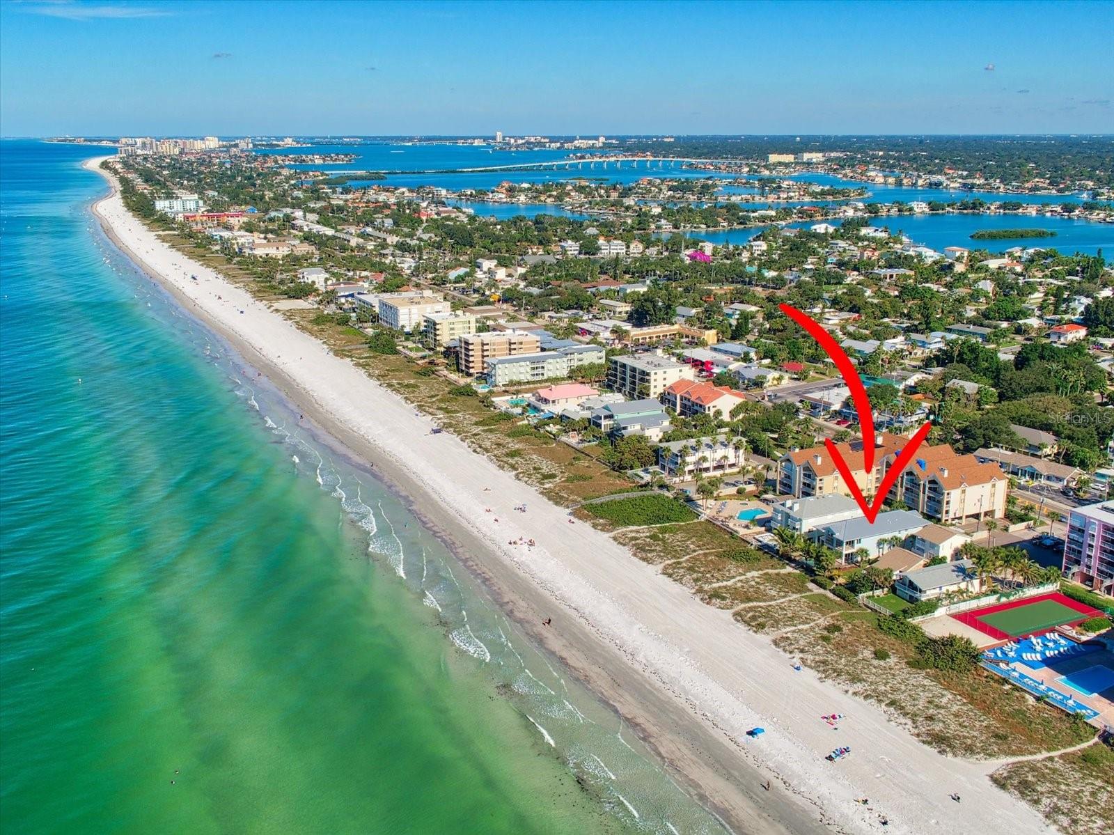 Enjoy exquisite Beachfront Living in this Newer (built in 2018) Gulf Front Luxury Custom Home. Enjoy an endless panorama of sun, surf, sand and sea. This impeccably designed, tropically landscaped home sits atop the sands of Indian Rocks Beach. Capture glorious sunsets and sparkling water views. Built to capitalize on natural light and magnificent views, this stunning 3 bedroom, 2.5 bath exudes quality and understated elegance. The Gulf facing wall of 3 glass French doors lead to the spacious balcony overlooking the sand and sea. The fully air-conditioned garage impresses with plenty of room to park 4+ cars, add a workbench or store your toys. Past the garage area, stunning frosted glass panel barn doors lead into the Game Room, and 3 sets of glass French doors lead out to the covered sun deck, saltwater pool and spa, with WIFI operation, self-cleaning, heated Pebble Tec pool and waterfall spa, surround sound, outdoor shower, engulfed by tropical palms and landscaping, enclosed with perimeter fencing and a gate to the soft powdery sand path to the Gulf of Mexico. This home is the perfect setting for indulgent relaxation or lavish entertaining both inside and outside the home. You will immediately take note of the exceptionally fine details, and incredible “smart” features in this home, which is as distinctively stylish as it is tastefully comfortable. The beauty of this home inspires an artist to put brush to canvas, or a poet to put pen to paper. Savor a life of luxury in this one-of-a-kind beachfront oasis.