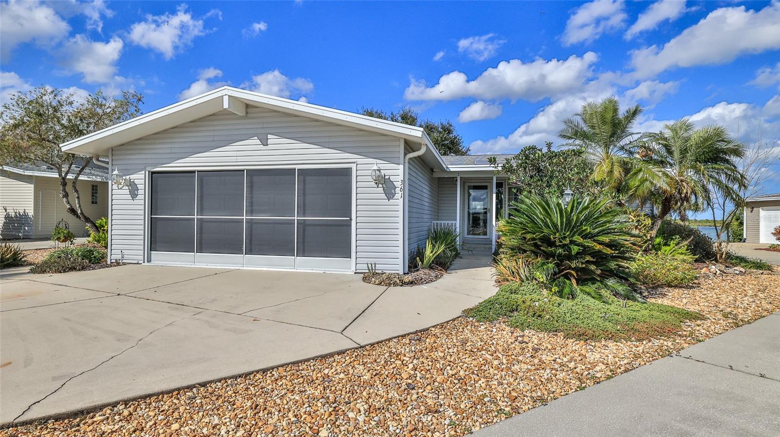 This direct waterfront hidden gem is located on the Indian River Intracoastal Waterway. Enjoy gorgeous sunrises, wonderful sea breezes and watch the boats cruise while sipping your morning coffee. Beautiful three-bedroom, two bath home has it all, an open floor plan, two car garage with an electric RV hookup, inside laundry room, large back screened patio with seasonal vinyl windows, vaulted ceilings and more. For those who love to cook, the kitchen has ample amount of counter space, recently updated appliances, and a spacious pantry. The primary bedroom opens onto the screened back porch and primary bath features a walk-in shower, jetted garden tub, double sinks and a large linen closet. Updates include hot water heater (2025), roof (2019), hvac unit (2020) and appliances (2024). Not a lot rental community, own your own land. Lighthouse Cove is a gated community where golf carts are a second means of transportation. Enjoy a large, heated swimming pool, recently renovated clubhouse, newly resurfaced pickleball courts, shuffleboard, boat launch for shallow water boats, recreational picnic area on the river and a fishing pier. It is a boating/fishing/shrimping paradise located a short distance from the Mosquito Lagoon. Watch the rockets launch from the fishing pier. Don’t miss out on a great opportunity to live in Paradise. A must see! All measurements approximate! Information deemed accurate but not guaranteed.
