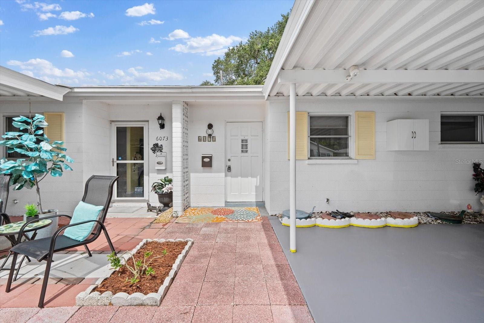 Welcome home to your maintenance-free Florida living in a 55+ community. This 2 bedroom, 1 bath updated villa is light and bright with pleasant coastal colors and beautiful backsplash in kitchen and bathroom. Kitchen features a double oven, dishwasher, garbage disposal, microwave and refrigerator. Bathroom even has a bidet! Check out the park like setting/view from the back patio. You will feel at home in this quaint community that has a heated pool, clubhouse with activities and library, laundry facilities (this unit has a stackable washer and dryer) internet provided in the clubhouse and free cable. Have a fur baby? One small pet (cat or dog) is allowed here!  This well maintained unit also has a new roof, HVAC was replaced in 2016 and electrical panel 2019.  Stay nice and cool with ceiling fans throughout. Need storage? This unit has great closet spaces, and attached carport. Don't want to worry about beach sand in carpeting? No worries here as there is ceramic tile and special bamboo flooring in primary bedroom. Check out the nice view from the back patio-park like setting with beautiful trees and no rear neighbors! This unit is also at the end of the cul-de-sac with no thru traffic. Location is superb as you are close to shopping, restaurants, downtown Bradenton or Sarasota and the Anna Maria Island beaches! Come and see it today so you too can have your own slice of paradise in sunny Florida!