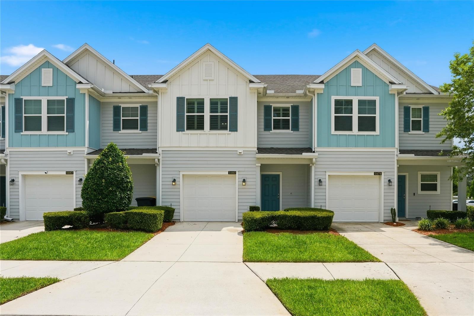One or more photo(s) has been virtually staged. Built in 2020 this beautifully maintained and UPGRADED Lennar ''Islamorada'' 1553 sq. ft 2 story home in a small 38 townhome community. The perfect blend of modern comfort, low-maintenance living, and an unbeatable Jacksonville location. A spacious 2-bedroom, 2.5-bath residence has UPGRADES including: 2'' PLANTATION SHUTTERS and FANS throughout, TILE throughout the main living area, REMO halo-LED purification HVAC system; WHOLE HOME WATER SOFTENER, TANKLESS WATER HEATER for endless hot water, SECURITY SYSTEM owned, custom Lanai vertical blinds and Closet by Design pantry installed. 

A thoughtfully designed living space with a 1-car attached garage and a desirable cul-de-sac location and extra guest parking. Inside discover an open-concept floor plan with wood-inspired tile flooring throughout the main living areas, a welcoming foyer.

The kitchen is designed for both functionality and style, featuring quartz countertops, 42'' cabinetry, a breakfast bar, Frigidaire stainless steel appliances, a custom kitchen backsplash, and a walk-in pantry outfitted by Closets by Design. A separate dining room provides additional space for entertaining and everyday living.

Thoughtful owner upgrades include plantation shutters throughout, updated dining room lighting, ceiling fans, vertical blinds, a whole-home water softener, and a Reme Halo LED whole-home air purification system. The tankless water heater provides endless hot water while adding energy efficiency and convenience.

Upstairs, both bedrooms offer privacy and comfort, including a spacious primary suite with a walk-in closet and private bath featuring a walk-in shower. The second-floor laundry room adds convenience to everyday living. Ideally situated for a connected lifestyle, offering convenient access to dining, retail, recreation, and the highly regarded Episcopal School of Jacksonville.