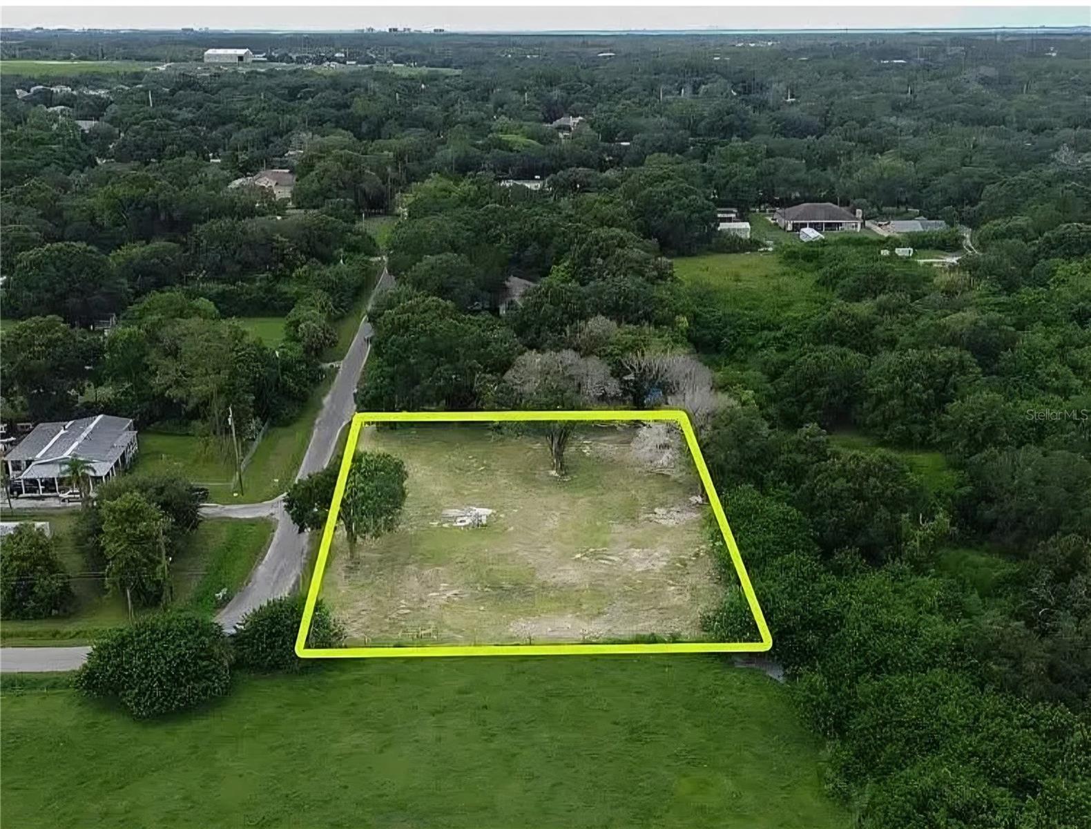 Build your dream home on this rare 0.71acre lot (30,931 sq ft) in the heart of Citrus Park, surrounded by new construction and some of Tampa's most desirable neighborhoods. This oversized property sits at the very end of the street, offering exceptional privacy, minimal traffic, and a quiet, tucked away feel that's increasingly hard to find.
With only one neighboring home, the lot is bordered on two sides by open land including a serene pasture where cows graze giving you a natural buffer, wide-open views, and a true Florida backdrop. It's the perfect blend of space, tranquility, and convenience.
Families love this area for its access to top-rated Hillsborough County schools, making it an ideal location for long-term living and strong resale value.
The neighborhood embraces a golf cart friendly lifestyle, giving you the freedom to ride to nearby shops, restaurants, parks, and local favorites without ever getting in the car. You're minutes from Westchase, multiple shopping centers, and everyday essentials like grocery stores, gyms, and major retailers.
Outdoor lovers will appreciate being close to the Upper Tampa Bay Trail, one of Tampa's most popular spots for biking, walking, and enjoying nature. The surrounding streets feature a mix of established homes and newly built properties, making this one of the last large lots available in a rapidly growing, high demand area.
Best of all, this property comes with NO HOA and NO CDD, giving you the freedom to design and build without restrictive rules or extra monthly fees.
With generous space for a custom home, unmatched privacy, and a location that continues to appreciate, this lot offers long-term value and flexibility that is rare in Tampa