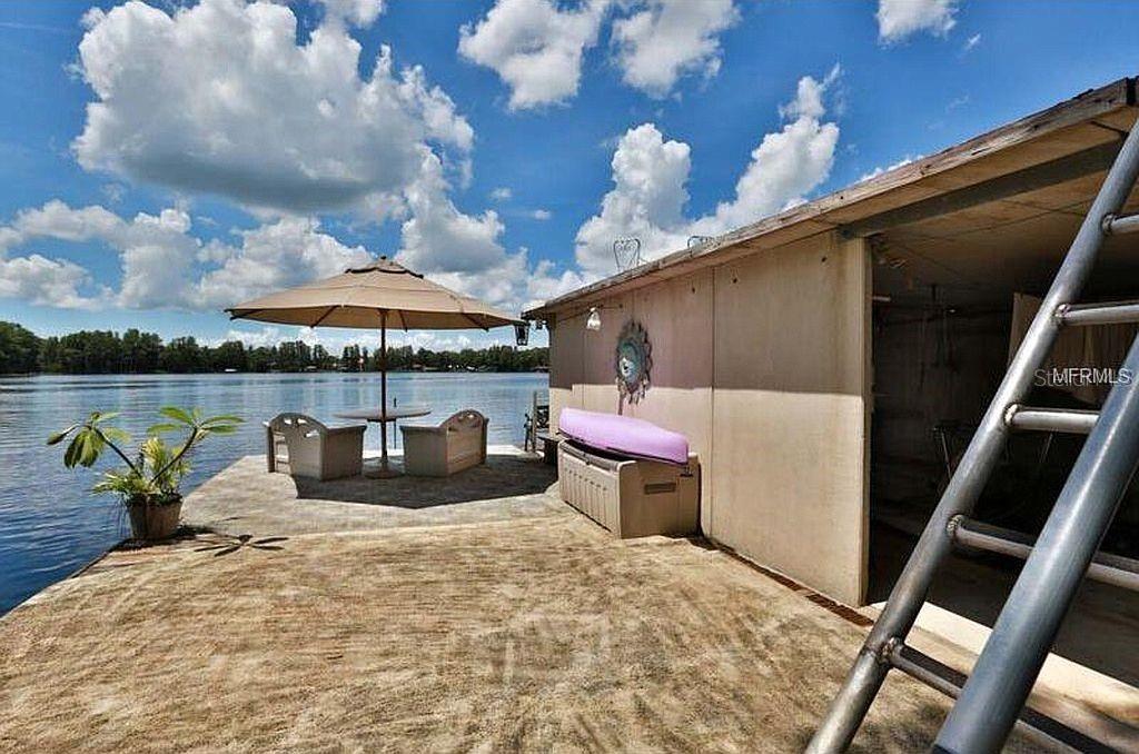 LOCATION,LOCATION,LOCATION Private Gated waterfront home with endless possibilities! Direct Lake Keystone access, one of Hillsborough County's Largest Lakes! This home Is very versatile -whether for a single family or Family with In Law Suite. Bring your Boats,Jet ski's,Fishing Poles etc---even room for RV storage. Enter into the Large Great room with direct views to the Lake. Large Formal Dining Area and enormous Kitchen! Plenty of sliders welcoming the outdoors in ,covered and screened patios/ The Main Home has 4 bedrooms. Large Master suite cover the whole upper back of home with 2 Balconies. Large Walk in closets and Large Master Bath. Large 2nd Master suite located on the First floor-tucked away for privacy yet also has a Lake View. At the Front of the home is a Very Large Apartment with Full Bath and Bedroom. Plua 3 Car Garage !Enjoy Beautiful Sunsets !!