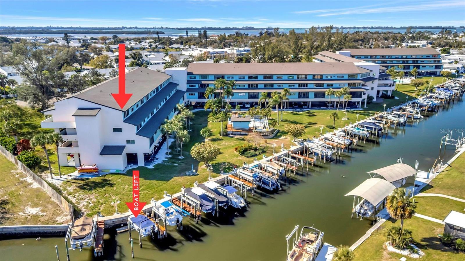 Welcome to the transformed Waterway Condominiums, where cheerful coastal living meets thoughtful design and effortless boating access. This 3-bedroom, 3-bathroom turnkey end-unit has been extensively restructured following storm improvements and now showcases high-end finishes and modern upgrades throughout, creating a move-in-ready opportunity in one of West Bradenton’s most desirable waterfront communities.

Step inside to discover a bright, open layout enhanced by new luxury vinyl plank (LVP) flooring, fresh interior paint, and stylish ceiling fans. The updated interior features custom closets, extra insulated storage, and a well-equipped laundry room with a convenient wash basin. Designed for comfort and flexibility, the home also includes a Murphy bed, neutral coastal décor, and multiple dining and gathering spaces with a dining table, breakfast bar, and ample seating for entertaining.

Positioned as a premium end unit, this residence captures stunning canal and Palma Sola Bay views, where daily sightings of manatees, birds, and abundant Florida wildlife create a truly serene waterfront backdrop.

For boating enthusiasts, this property is a rare find—complete with a deeded boat slip and lift, offering access to open water. Enjoy exploring nearby sandbars, world-class fishing, island hopping, and popular waterfront dining destinations—making this an absolute boater’s dream lifestyle.

The Waterway Condominiums community offers a wide array of amenities, including a heated pool, spa, fitness center, grills, clubhouse, billiards room, ping pong, and tennis courts, all designed to support an active and social coastal lifestyle. The association fees cover nearly everything except electric, providing exceptional value and simplified ownership.

Ideally located with the pristine beaches of Anna Maria Island—less than 3 miles away—you’ll enjoy easy access to sugary sands, turquoise waters, and a vibrant selection of local restaurants, shopping, and entertainment even closer to home.

Whether you're seeking a full-time residence, seasonal retreat, or investment opportunity, this beautifully upgraded waterfront condo delivers the best of Florida coastal living, boating convenience, and low-maintenance ownership.