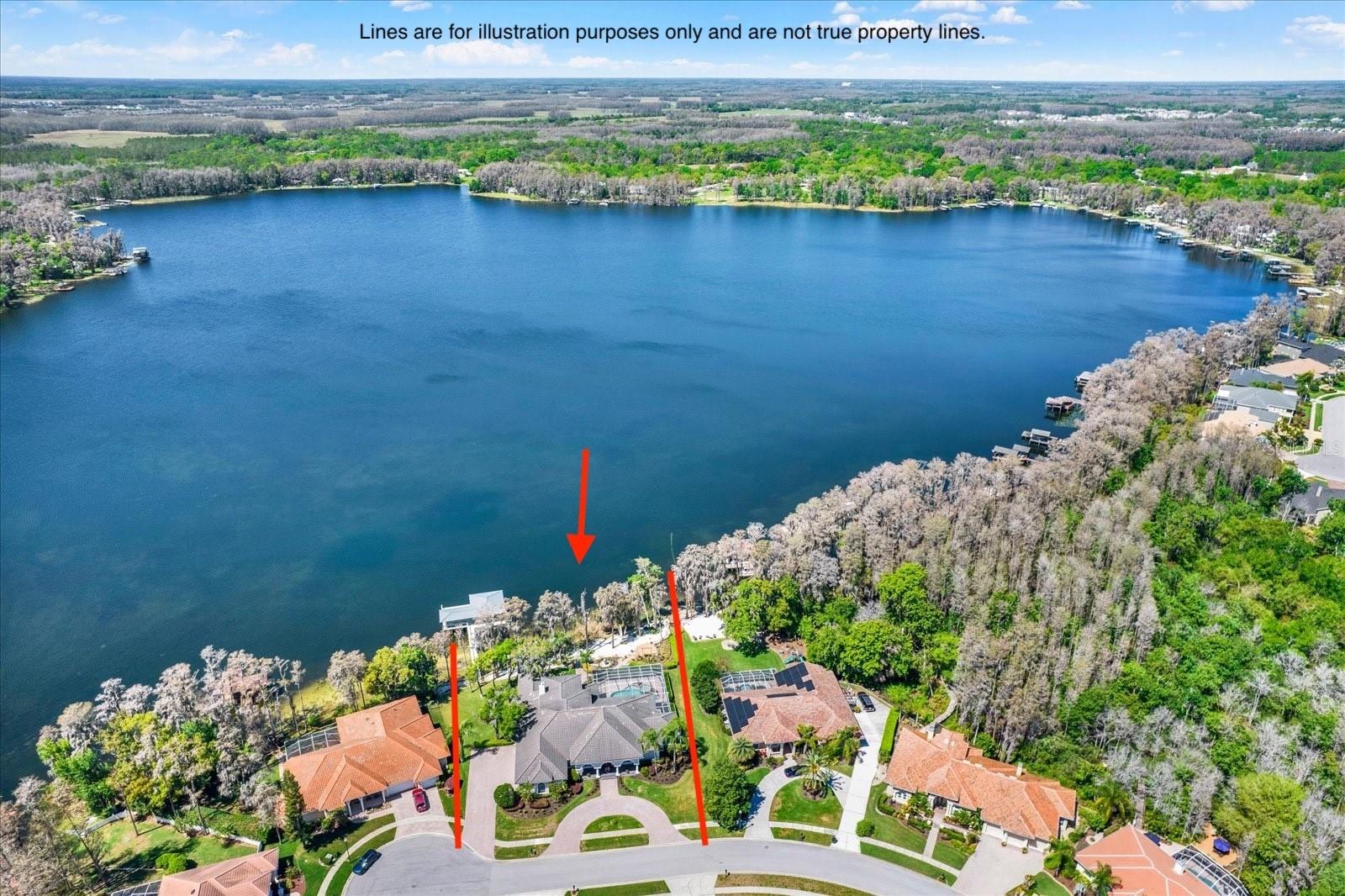 This home is for true lake lovers. Enjoy boating or waterskiing during the day and soak in breathtaking sunsets at night. With almost 190' of frontage on Lake Thomas, the panorama will not disappoint. The private dock includes a boat and dual jet ski lifts, shaded seating, a fan, and even ladders to get in and out of the crystal clear spring-fed lake. Tucked into the back of a gated community, the Preserve at Lake Thomas, this remarkable home offers the perfect blend of privacy and natural beauty. Arriving at the home, you're greeted by a grand circular driveway in front and a side-entry three-car garage. The double door entryway opens into a bright, open dining and living room, where patio doors frame a stunning view of the lake beyond and gorgeous sunsets. To the right is a spacious office with floor-to-ceiling built-in bookshelves, a full pool bath, and the primary suite. From the primary bedroom, you'll wake up to stunning views of the pool and lake. The primary bathroom includes lots of natural light, expansive counter space, a jetted tub, and an oversized shower. To the left of the entryway is the open kitchen with a center island, breakfast space with frameless windows overlooking the pool, the family room, three bedrooms, and stairs to the open loft with a wet bar. The family room has unobstructed views of the lake, a fireplace, a built-in TV console, and sliding patio doors to the pool. At the back of the house is a generously sized bedroom, again framing gorgeous scenery of the lake, and a full bathroom. This area has a pocket slider and would serve wonderfully as an in-law suite. The other two bedrooms share a Jack and Jill bathroom, and both have walk-in closets and a bay window. Just off the kitchen, the spacious laundry room has a large closet, generous cabinet storage, and ample counter space. Upstairs, the large loft overlooking the family room includes a wet bar and even more lake views to enjoy. Outside, owners will take in the expansive screened pool area with a spillover heated spa and shaded areas for relaxing throughout the day. The grounds have been well thought out with a walking path to a seating area to soak up the sunsets and a sandy beach. This home encompasses two lots to enjoy the best scenery and privacy on this 165-acre ski lake. The home could use some updates to match your taste, but it is not required in order to move in.