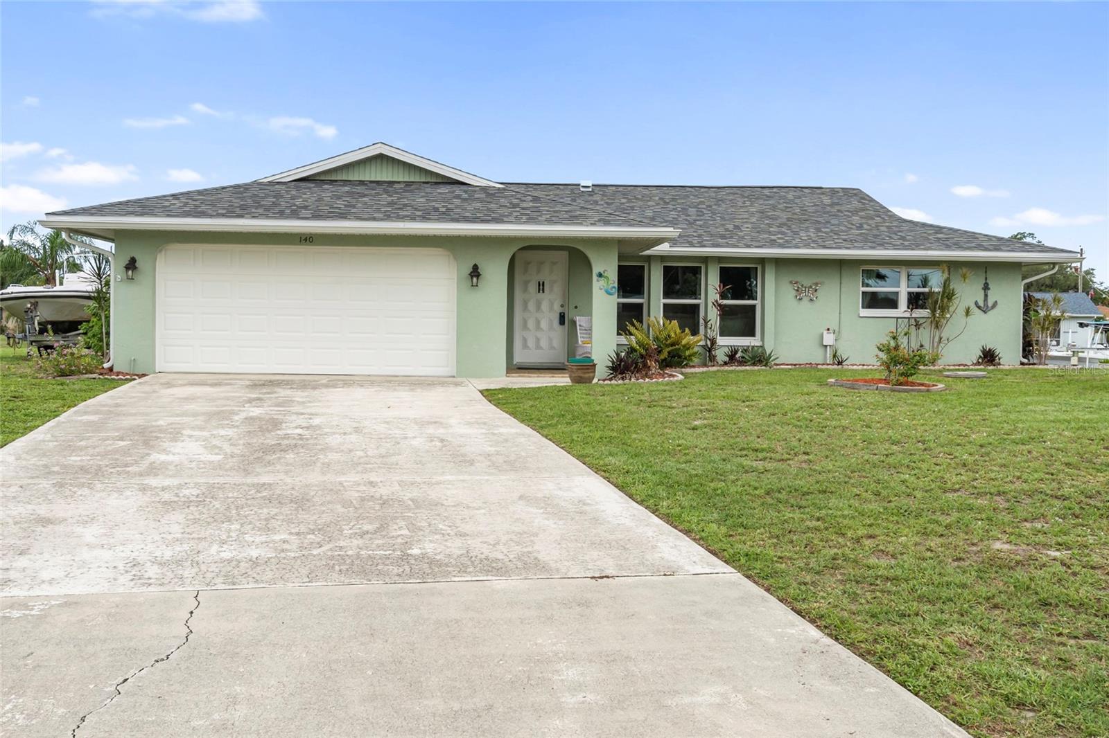 Great opportunity to enjoy Florida waterfront living! This 3-bedroom, 2-bath pool home is situated on an oversized saltwater canal lot with 135 feet of seawall and quick boating access to Charlotte Harbor with only one fixed bridge. The home features an updated kitchen with newer appliances, spacious living areas, abundant storage, and walk-in closets throughout. The enclosed lanai adds additional living space and overlooks the private pool and waterfront setting. Dock with water and electric, davits, partially fenced backyard, attached storage/workshop area, and ample outdoor space make this property ideal for year-round living, seasonal use, or investment potential. Centrally located near hospitals, shopping, dining, and just a short drive to Punta Gorda and Murdock. Hurricane Impact Windows 2023, New Roof 2022, New Pool Cage 2024
