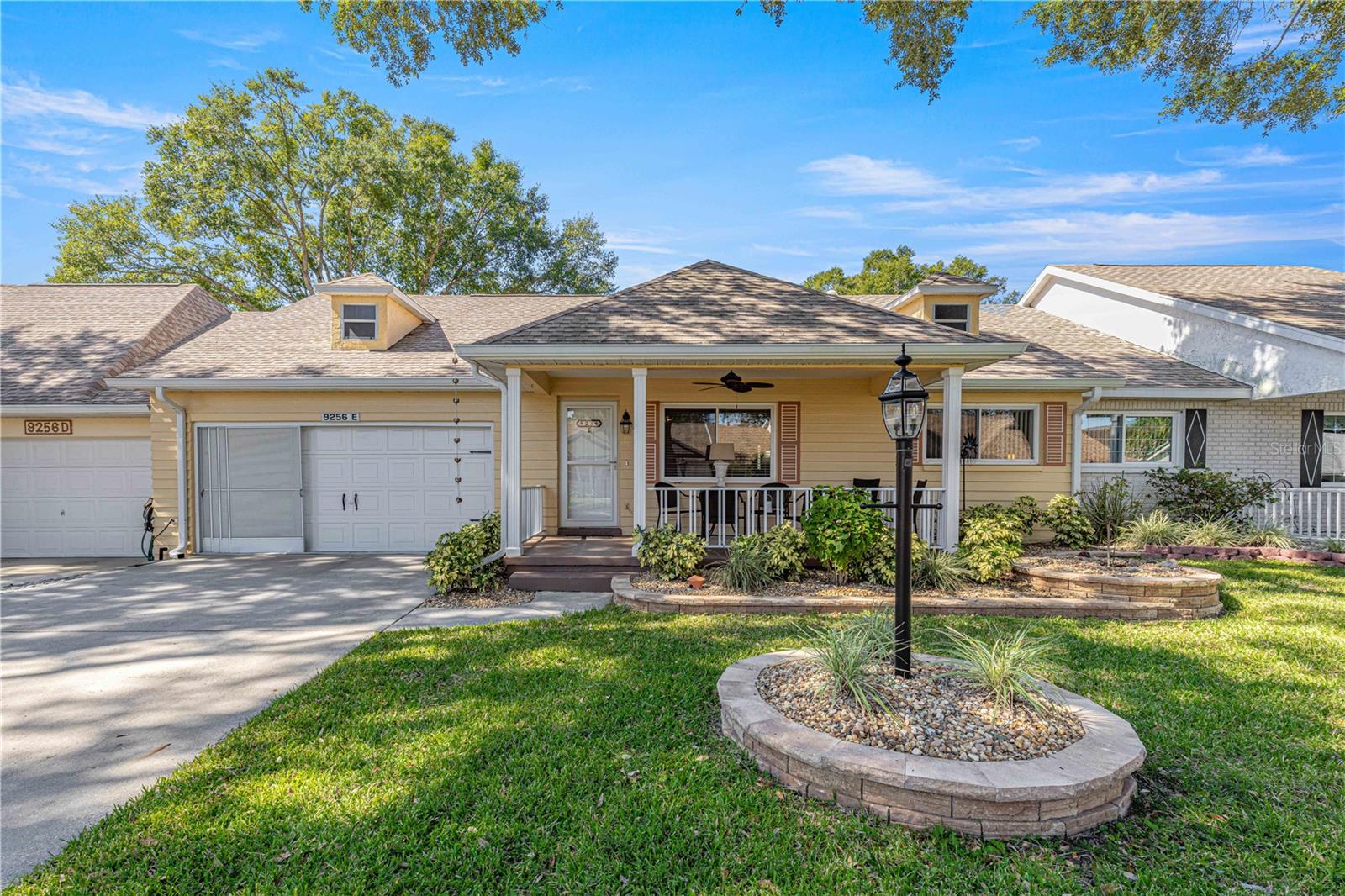 UPGRADES GALORE & COMPLETELY MOVE-IN READY! Welcome to this beautifully updated Montgomery Model Villa in the highly desirable Friendship Colony neighborhood of On Top of the World, Ocala's premier gated 55+ golf community. Combining modern upgrades with easy, maintenance-friendly living, this spacious 2-bedroom, 2-bath villa with a 2-car garage is ready for you to simply move in and start enjoying Florida's active adult lifestyle. Major improvements provide peace of mind for years to come, including a 2023 HVAC, 2021 ROOF, energy-efficient windows (2011) with transferable warranty, updated plumbing with all water lines relocated to the attic, and an inviting birdcage enclosure perfect for outdoor relaxation. Exceptional curb appeal begins with custom stacked-stone landscaping and a welcoming covered front porch—an ideal spot to enjoy your morning coffee or unwind in the evening while taking in the peaceful, tree-lined street. Inside, you'll appreciate the bright, open floor plan featuring attractive laminate flooring and a solar tube that fills the Great Room with natural light. The thoughtfully designed split-bedroom layout offers privacy for both homeowners and guests. The guest bedroom is conveniently located at the front of the home, adjacent to a beautifully remodeled guest bath featuring a custom tiled step-in shower with glass enclosure, updated vanity, and comfort-height toilet. The private owner's suite is tucked away at the rear of the home and includes a spacious walk-in closet and an updated en-suite bath with a new vanity, glass-enclosed shower, and comfort-height toilet. The heart of this home is the stunning, fully remodeled kitchen! Every cabinet has been replaced with upgraded soft-close cabinetry featuring convenient pan drawers, complemented by a deep sink, brand-new stainless-steel appliances, updated lighting, and abundant storage—creating a space that's as functional as it is beautiful. The kitchen flows seamlessly into the family room, making it perfect for entertaining family and friends. Just beyond, the fully finished Florida Room offers additional year-round living space with no step-down, making it easily accessible and ideal for relaxing, hobbies, or entertaining. Expansive picture windows provide abundant natural light while overlooking the spacious birdcage and patio—perfect for grilling, dining outdoors, or simply enjoying Florida's beautiful weather. If you've been searching for a meticulously updated, truly move-in-ready home with all the major improvements already completed, this exceptional villa offers the carefree lifestyle you've been waiting for in one of Ocala's most sought-after active adult communities. The monthly HOA fee includes basic cable, irrigation water, roof repair, exterior painting every seven years, exterior maintenance and insurance, landscaping, trash & recycling, 24/7 guarded gates and all the amenities that OTOW has to offer; four pools (3 outside (1 is BRAND NEW) & 1 inside), two state of the art fitness centers, pickleball, billiards, archery range, multiple dog parks, corn hole, bocce ball, tennis, shuffleboard, horse shoes, remote control flying field and race cars, 175+ clubs, woodworking shop (extra fee), library, and much, much more! A golf cart community with access to three shopping centers.