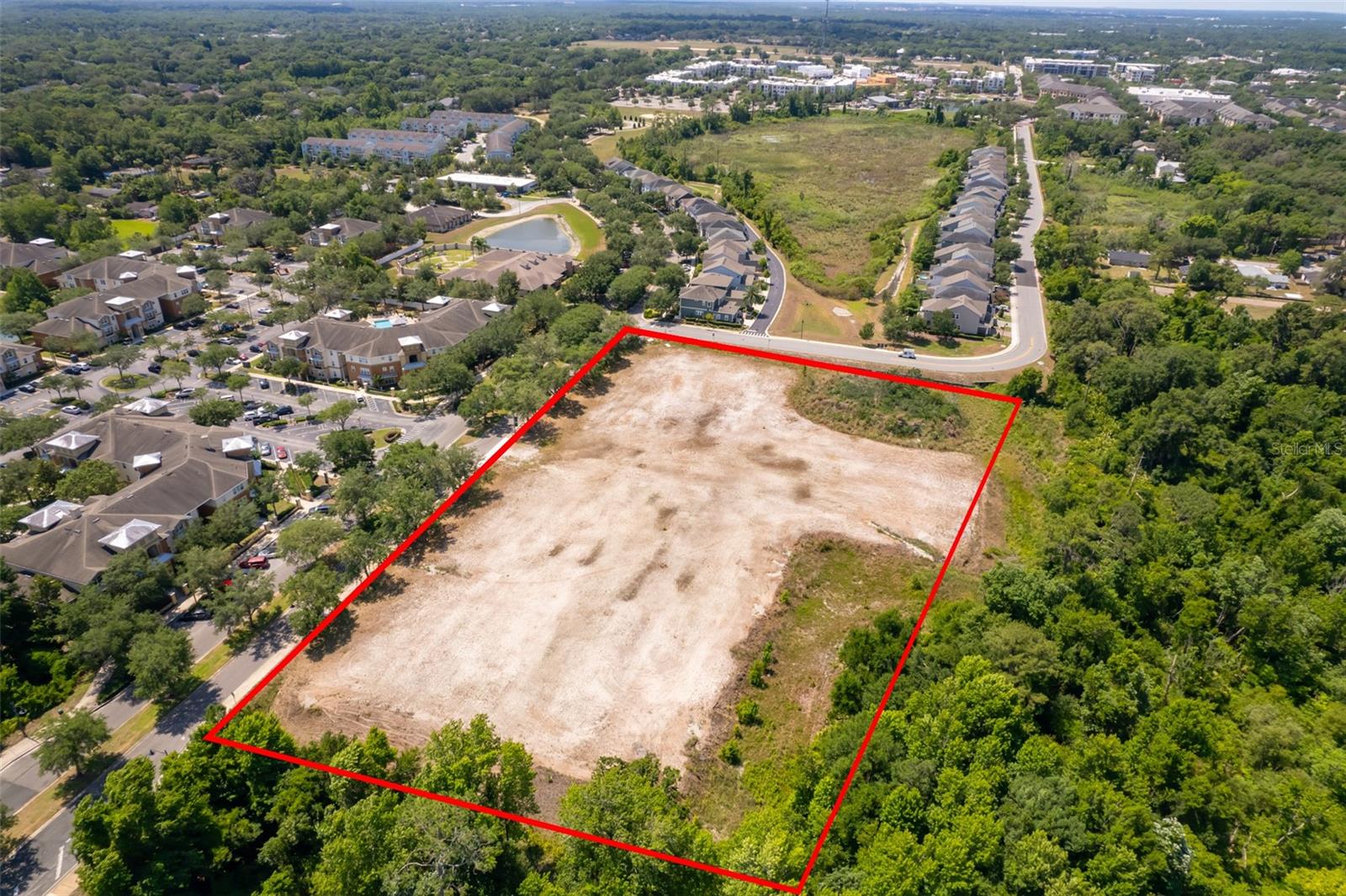 Under contract-accepting backup offers. Great opportunity to develop one of the last large tracts of land by Oviedo on the Park. Previously approved and engineered for an approx. 100k medical office building and parking garage. Oviedo Downtown transition zoning allows a multiple amount of uses including multi family, townhomes, condos, mixed use. with bonus densities available for certain uses. Fill and Mitigation work has already been done to accommodate the planned office building and mitigation credits are available to expand the footprint. Be within walking distance of Oviedo On the Park and all that is included: Center Lake Park & Cultural Center, Restaurants, aquatics, pickleball, splash center, playgrounds, single family homes, state of the art apartments (all at capacity), townhomes, the New Food Factory, walking paths, concerts and many more desirable social/lifestyle components.