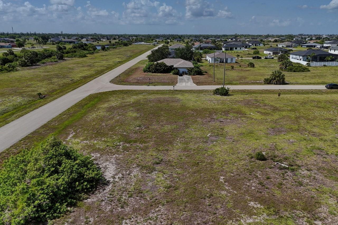 Bring your vision to life on this quarter-acre corner lot in Cape Coral's Burnt Store neighborhood — right in the heart of the city's booming Northwest Quadrant. Whether you're ready to build your dream home now or want to secure a foothold in Southwest Florida's land market for later, this is your chance to plant a flag in one of the region's fastest-growing corridors.
Location is everything, and this lot delivers. Head east and you're minutes from Fort Myers' shopping, dining, and culture. Head west and Matlacha and Pine Island open up with waterfront dining, island charm, and boat access — day or night, there's always somewhere to be. And as part of Cape Coral — home to more canals than any other city in the world — you're never far from boat ramps, waterfront living, and the laid-back canal lifestyle the city is famous for.
For the outdoor enthusiast, this is about as good as it gets: Charlotte Harbor Preserve State Park to the west and the Fred C. Babcock/Cecil M. Webb Wildlife Management Area to the east put world-class hunting, fishing, hiking, biking, and wildlife viewing right at your doorstep. Prefer a quieter round of golf? Coral Oaks Golf Course is just 6 miles away.
This is more than a lot — it's a lifestyle. Build the home you've always wanted, surrounded by nature, water, and everything Southwest Florida has to offer.