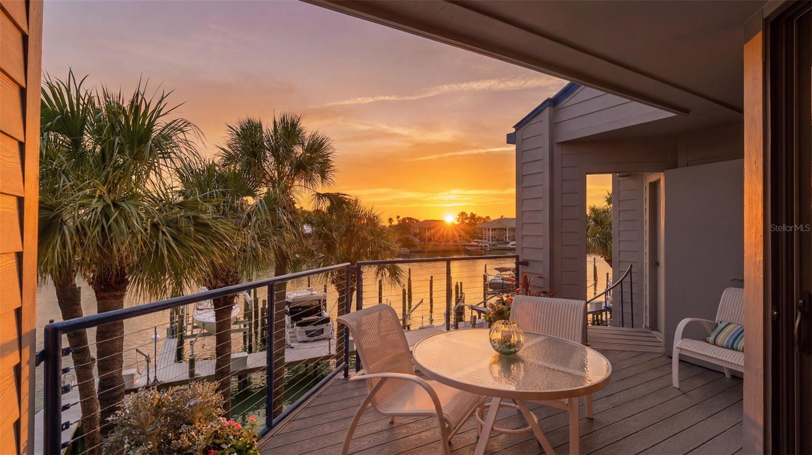 Stunning extra-large condominium on The Grand Canal, with a 50-foot-long slip and davits for your tender, located on a world-class waterway with quick, direct access to The Gulf of Mexico and nearby fuel and boat repair. Inside, this exceptional condo blends comfort with coastal elegance. Expansive living spaces are filled with natural light and tranquil water views. The inviting open floor plan, perfectly appointed in soft coastal colors, features a beautiful great room with a fireplace and wet bar, a stylish dining room, a sleek modern kitchen with water-facing dining space, a laundry room, two bedrooms (one currently used as a den with handsome built-ins),  and 2 bathrooms. The gorgeous primary suite is upstairs, with the entire level to itself. Not only is this suite exceptional for its awesome water views and fireplace, but the modern bathroom also features a walk-in shower and a spectacular tub where you can relax, soak, and stargaze. The owners have created an office space on this level, and there is a storage room larger than you can imagine. The slip has power and water. It measures 18' x 50'.  The buyer should verify slip measurements to ensure their boat fits. Lifts are permitted with board approval. The slip fee for this year was $330. Association pays for the Bronze Spectrum package. Port Tierra is known for well-funded reserves, and the grounds, large sparkling pool, and dock are always kept in beautiful condition. The pool has heat for winter and a chiller for summer. This delightful condo is the perfect spot to unwind after a busy day, host family and friends, or simply relax at home—without ever feeling cluttered or cramped, knowing your boat is just steps away in deep, protected water. Port Tierra is constructed with one-story condos on the ground floor and two-story condos on the second floor. This condo is on the second and third levels.
If you ever must leave your slice of paradise, with quick access to #275, you can be at TPA or PIA quickly or enjoy all the advantages of a major metropolitan area. Click on any photo in this listing to enlarge the photo.