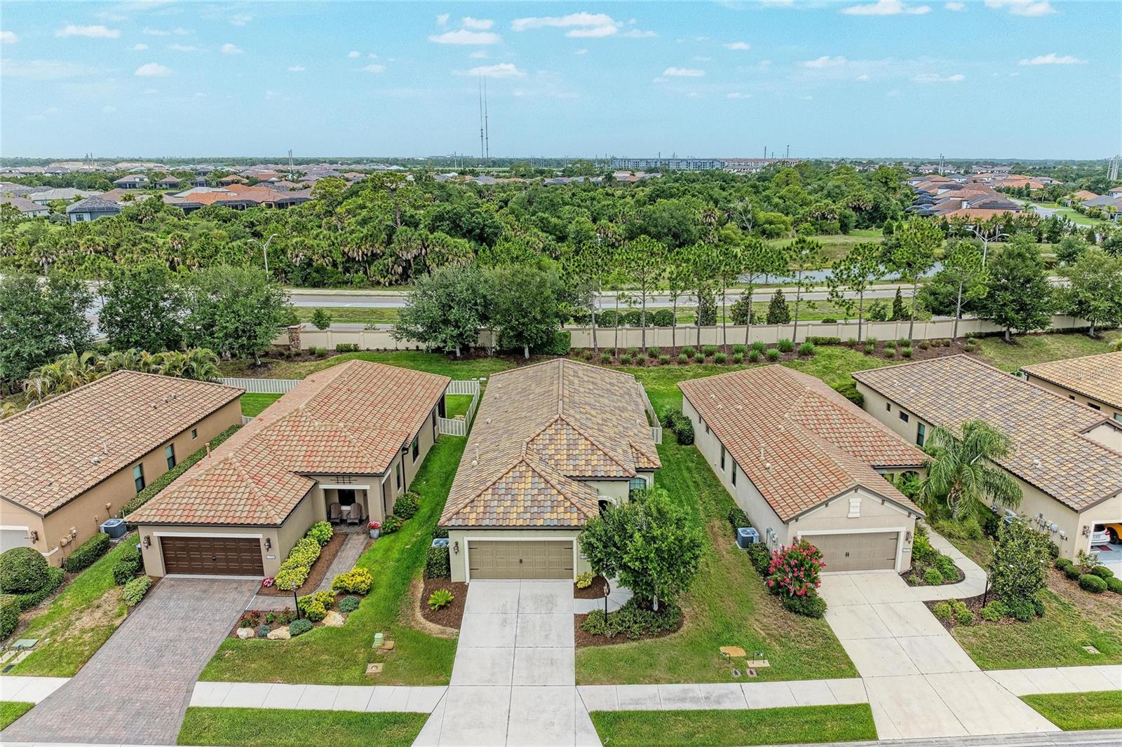 Imagine moving to Florida and spending less time maintaining your home and more time enjoying why you moved here in the first place. Morning walks through the neighborhood. Pickleball with friends. A quick drive to Nokomis Beach. Dinner in downtown Venice. Quiet evenings on your screened lanai. That's the lifestyle waiting at 213 Alfero Way. Located within the gated community of Milano, this move-in ready Neal Communities Victory model offers a rare combination of comfort, convenience, and value in one of Nokomis' most desirable lifestyle communities. Built in 2016, the home features 3 bedrooms, 2 bathrooms, a flexible den, and an open-concept design that feels both spacious and welcoming. At the heart of the home, the kitchen was designed for gathering. Quartz countertops, stainless steel appliances, abundant cabinetry, and a large center island create a space that works just as well for everyday living as it does for entertaining family and friends. The kitchen flows seamlessly into the dining area and living room, where tray ceilings, natural light, and neutral finishes create a bright, coastal-inspired atmosphere. The split-bedroom floor plan provides privacy for owners and guests alike. The spacious primary suite offers a peaceful retreat with a walk-in closet, dual vanities, and a walk-in shower. A custom barn door adds character and warmth, while the additional bedrooms and dedicated den provide flexibility for visiting family, a home office, hobbies, or seasonal guests. Step outside and discover one of this home's most desirable features—a screened lanai overlooking a fully fenced backyard with no direct rear neighbors. Whether you're enjoying your morning coffee, letting pets roam freely, or hosting friends after a day at the beach, this outdoor space offers privacy that's increasingly difficult to find in newer communities. Beyond your front door, Milano delivers the lifestyle that has made Nokomis one of Southwest Florida's fastest-growing destinations. Residents enjoy a resort-style pool and spa, pickleball courts, bocce ball, fitness center, clubhouse, dog park, walking paths, and an active social calendar, all with low HOA fees and no CDD. The location is equally compelling. Just minutes from Nokomis Beach, Venice Island, downtown Venice, golf courses, waterfront dining, shopping, and easy access to I-75, you'll enjoy the perfect balance of coastal living and everyday convenience. Whether you're searching for a full-time residence, seasonal retreat, retirement home, or low-maintenance Florida lifestyle, 213 Alfero Way delivers exceptional value in a location that continues to grow in demand. Because the best Florida homes aren't just about where you live. They're about how you live.