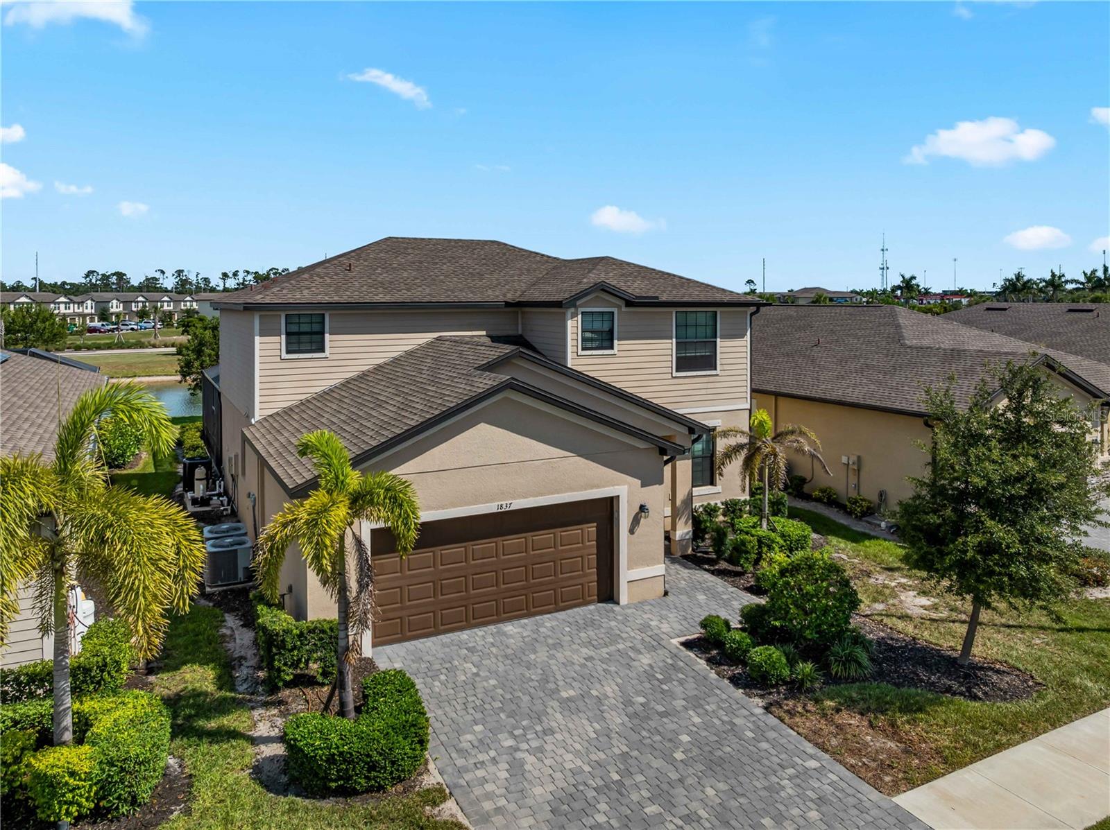 Welcome to 1837 East Isles. The absolute best value pool home currently available in Charlotte County! Located in the highly sought-after Isles at West Port, this stunning 4-bedroom, 3-bathroom residence offers over 2,500 square feet of beautifully designed living space and the perfect blend of comfort, style, and convenience. 

Positioned on a sought after waterfront homesite, this home showcases breathtaking lake views from the screened lanai, sparkling pool, and relaxing spa—creating the ultimate Florida outdoor living experience. Inside, you'll find an open-concept floor plan featuring granite countertops, stainless steel appliances, spacious living and dining areas, walk-in closets, dual vanities, and numerous builder upgrades throughout.

The paver driveway and lanai add curb appeal and functionality, while the included Ring security system provides added peace of mind whether you're home or away.

West Port is one of Port Charlotte's fastest-growing master-planned communities, ideally situated between US-41 and SR-776 and surrounded by exceptional recreational amenities. Residents enjoy convenient access to Centennial Park's walking trails, playgrounds, soccer and baseball fields, and are just minutes from the Tampa Bay Rays Spring Training Facility. Shopping, dining, boating, golf courses, and Gulf beaches are all within easy reach.

Whether you're looking for a primary residence, seasonal retreat, or investment opportunity, this exceptional lakefront pool home delivers outstanding value in one of Southwest Florida's most exciting new communities. Schedule your private showing today and experience the Florida lifestyle you've been dreaming of.