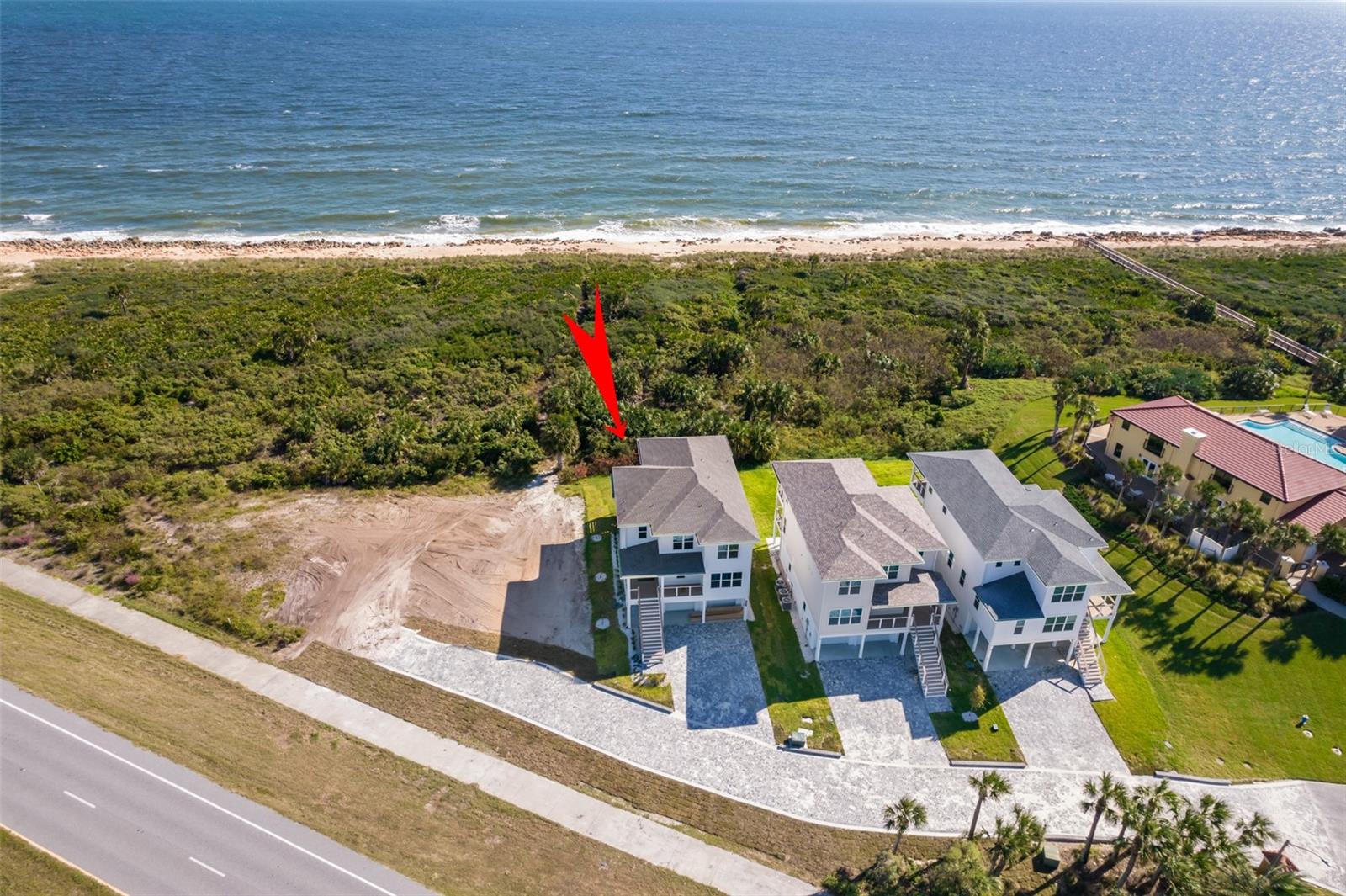 SELLER MOTIVATED! DON'T MISS OUT!   DIRECT OCEAN FRONT  – NO FLOOD ZONE.   Enter the home by way of the ground floor or ascend to the second floor where the impressive double front entry is located that leads you to the massive great room where your family and friends can gather.  Open kitchen concept with center island, convection cooktop, double ovens, microwave drawer, refrigerator, butlers’ pantry and double beverage center, to name a few.  Just beyond the kitchen is the guest master suite with its own entrance and covered veranda to watch the sun sets.  From the main living space take in the breathtaking views of the Atlantic Ocean with covered porches or take a short stroll to the beach.  The third floor master suite takes advantage of the ocean front panoramic views which stretch the entire length of the home, master bath with double vanities, walk in shower, private water closet and large walk-in closet with custom built ins.  Two additional guest suites located on the 3rd floor along with a full bath and a large laundry room for easy access.  Located on ground floor is the oversized large 5th bedroom which can also be utilized as either a bedroom or a recreation room with walk in closet, full bath and double doors that lead to the back yard.    Oversized double car garage with plenty of space for storage.   All bedroom closets have custom organized closet systems.  This home comes with the ability to install your own ELEVATOR if you want one, or keep as extra storage till later.   Solid wood interior doors throughout, custom window treatments outfitting some areas with blackout shades and remote controls, solid quarts surfaces throughout, upgraded designer lighting, fixtures and finishes, modern wood plank flooring.  Spray foam insulation.  Buried propane tank ready for your barbeque grill and hookups for your appliances.  Tankless propane water heater, 3 HVAC zones, outdoor shower, landscaping and irrigation system.  The finest appointments and expert craftsmanship are found throughout this stunning coastal style beach home located in one of the most sought-after locations of Matanzas Shores in Palm Coast, providing membership to the adjacent amenities that are included such as usage of the pool, beach club, rec center, boat club, boat dock, tennis and shuffleboard courts, horseshoe pits, volleyball, library.  Easy access to nearby Marine Land, Hammock Dunes, St. Augustine, Flagler Beaches, golf courses, water sports, shopping and entertainment.