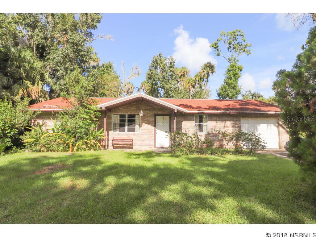 THE PERFECT SETTING FOR A QUIET LIFE! This 3 bedroom and 2 bathroom concrete block home is in a peaceful neighborhood and conveniently located within 5 minutes of Walmart, Aldi and Home Depot. Only 10 minutes to historic NSB CANAL STREET and the BEACH. Enjoy your back porch and identify the many species of birds in your backyard sanctuary. The adjoining parcel 80 x 120 to the north may be purchased with this home and used for your BOAT or RV. 2016 ac, 2016 hot water heater, 30 yr - 2009 architectural shingle roof. ;Water: City