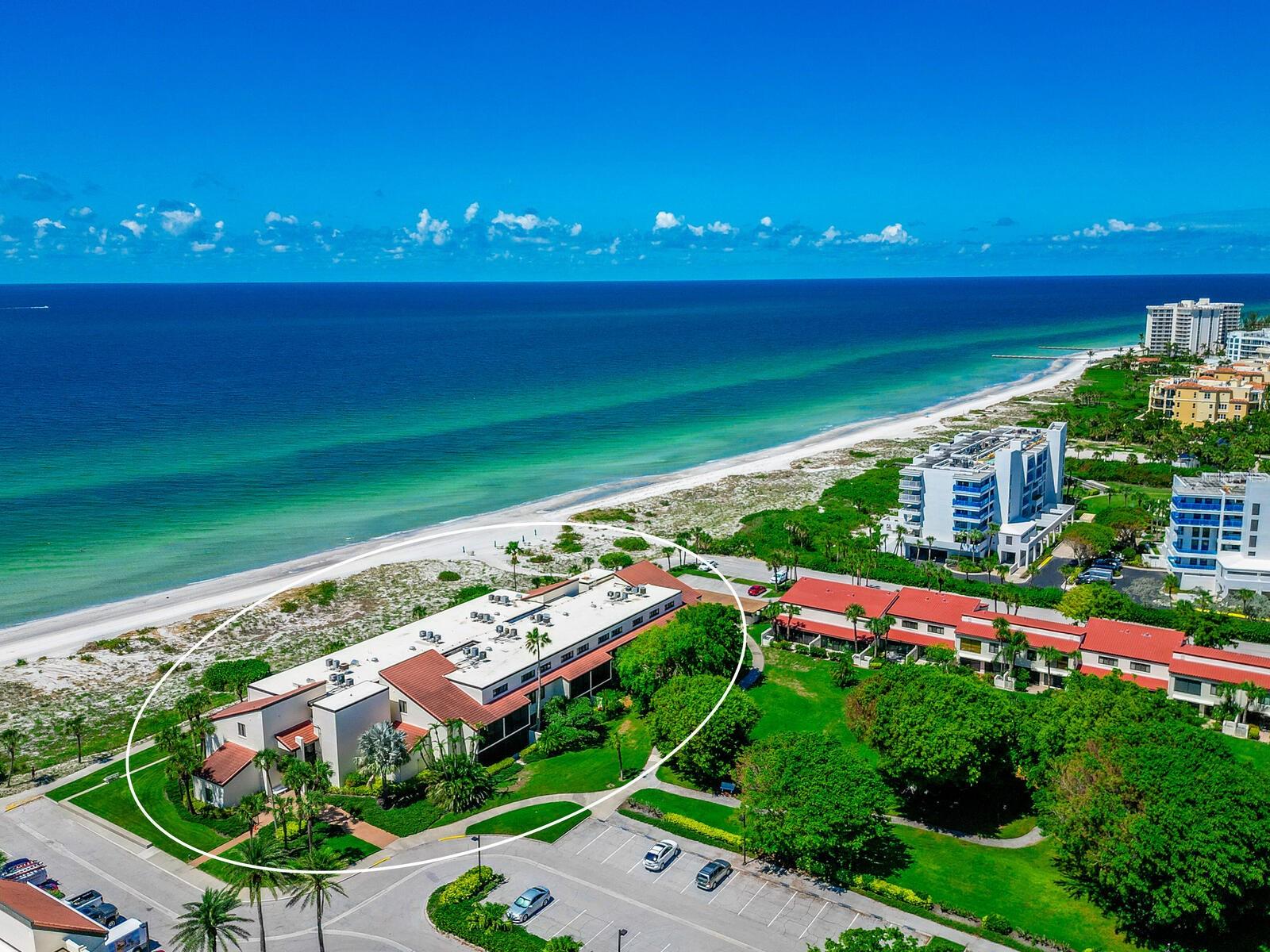 Providing you with an unobstructed view of the gorgeous Gulf of Mexico.  A private screened balcony allows you to enjoy your morning coffee while watching the sun dance across the glistening water and later to witness the glorious sunset from which you will never tire. A wonderful opportunity to own this lovely gulf front residence. From the moment you open the front door you are welcomed by a peaceful energy into this 2 bed/2.5 bath condominium. Thoughtful planning was given to the updating to provide a bright open Florida feel. A contemporary design enhances the main living area – the kitchen has been opened up and finished with quartz counters, wood cabinetry, LED lighting, and a stainless appliance package.  The flooring throughout is a light engineered hardwood. Living area consists of neutral wall color, crown molding, and a functional built-in display/entertainment cabinet. Upstairs, the main and guest bedrooms are both ensuite with renovations done to continue the tranquil simple design. On the main level is also a powder room and in-unit laundry closet. A near-by storage locker is included. Assigned parking space is #79. The living room sliders are a recent upgrade - 2021 Hurricane rated. All openings, including the new sliders, have hurricane shutters which are a simple flick of the switch and down they come.  This residence would make a wonderful vacation getaway or investment. The G1 building is directly on the gulf and you are only moments away from the beach and pool. Seaplace is a unique community with 42 acres of magnificent oak and banyan trees, two swimming pools with spas, fitness center and a beautiful clubhouse. Only a short distance to famous St.Armands Circle and downtown Sarasota.