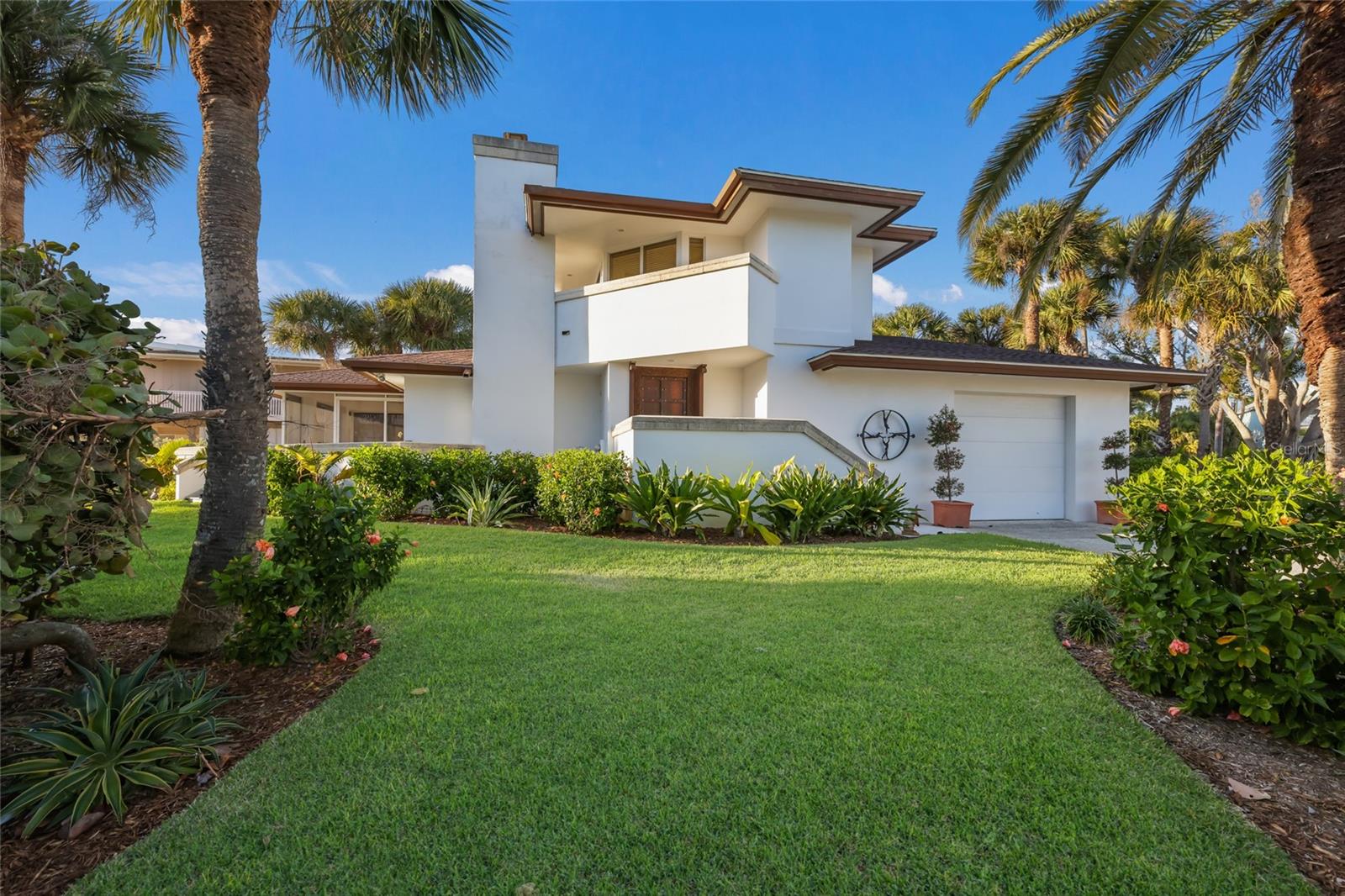 Discover refined coastal living at 106 49th Street, an elegant private residence in Holmes Beach on Anna Maria Island, one of Florida’s most exclusive and picturesque island communities. Celebrated for its fine sand beaches, turquoise Gulf waters, spectacular sunsets and relaxed atmosphere. Anna Maria Island is a desired destination for discerning buyers seeking lifestyle and long-term value. While positioned steps from the Gulf, the home's architectural design creates the unmistakable sensation of beachfront living, where water, sand and native seagrass become part of the everyday backdrop. This beautifully proportioned home offers a generous three-bedroom, three-bathroom layout, ideal for year-round living, seasonal enjoyment or as a luxury holiday residence. The interior spaces are light-filled and welcoming, designed to accommodate private relaxation and stylish entertaining.  The home is designed with interior and exterior natural stone including an elegant coral fireplace. The property is set on a generous island parcel and features a private swimming pool, creating a resort-style environment for relaxation and outdoor living. Whether hosting guests, enjoying Florida sunshine or unwinding after a day at the beach, the outdoor space offers privacy and comfort in a tropical setting. An attached garage with ample storage adds to the home's practicality for extended or multi-season use. The island offers dining, boutique shopping and island amenities, the residence offers effortless access to everything that defines the Anna Maria lifestyle. Tampa International Airport and Sarasota-Bradenton International Airport provide convenient connections for international travel. This is a rare opportunity to acquire an island home in a desirable U.S. coastal market, combining privacy, natural beauty and timeless appeal in one exceptional location.