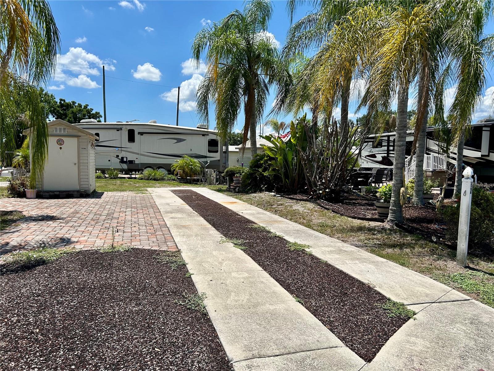 Welcome to Torrey Oaks RV & Golf Resort — a lively 55+ RV community nestled in the heart of Central Florida! This spacious lot accommodates either a Class A motorhome or a Fifth Wheel, with both 30-amp and 50-amp hookups available. A storage shed is included for added convenience. Residents enjoy an active, social lifestyle with a wide range of amenities and activities, including a swimming pool, pickleball and shuffleboard courts, fitness center, pool hall, bingo, karaoke, dancing, arts and crafts, card games, and tournaments. You’ll also find a fenced dog park for your four-legged family members and a catch-and-release fishing pond for a relaxing afternoon by the water. The HOA fee is $130/month, covering water, sewer, trash pickup, and full access to all amenities. There is also a $45 annual sewer fee.