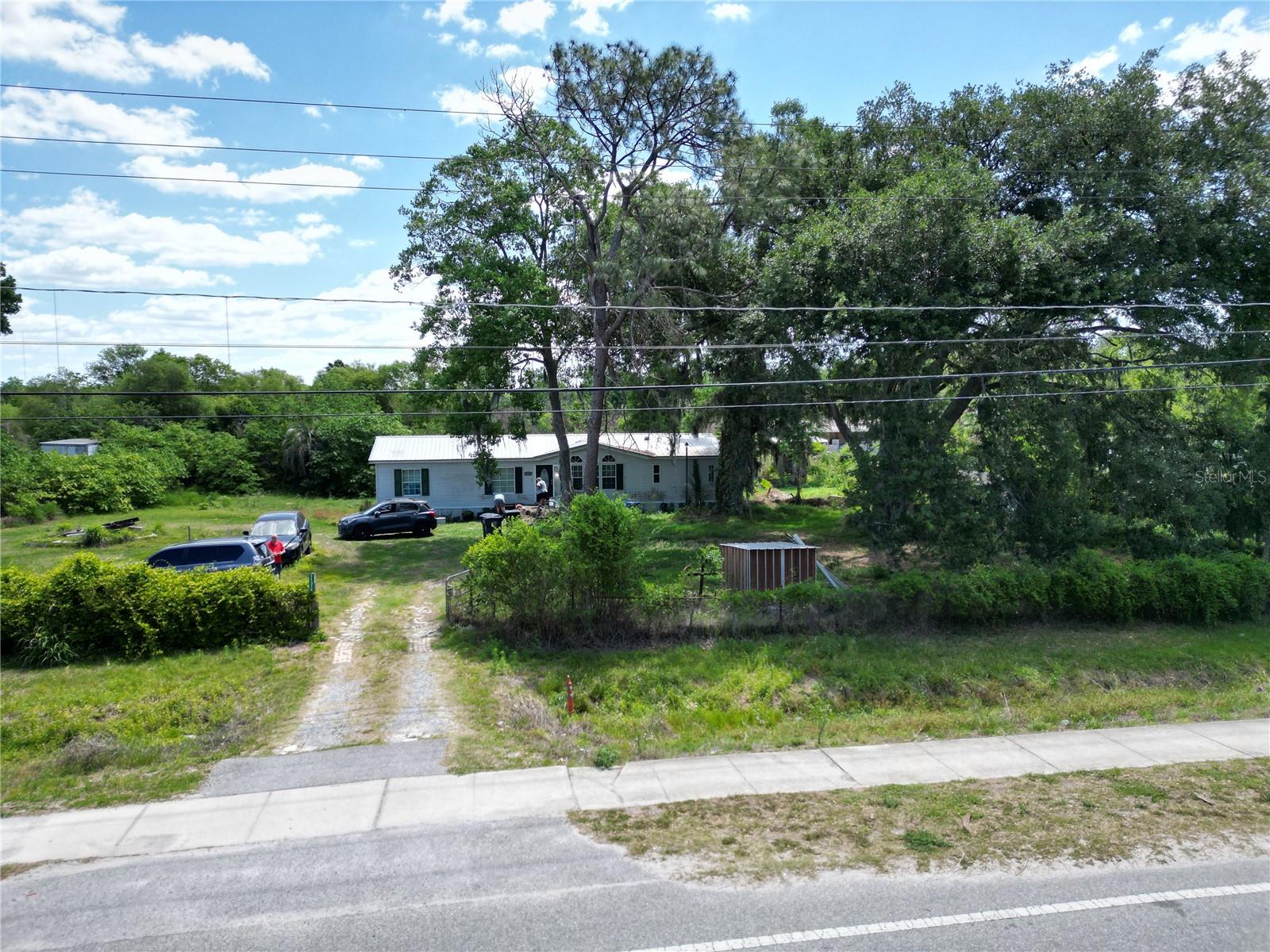 Perfect opportunity! This 3-bedroom, 2-bath home, built in 1997, offers endless potential and just needs a little TLC to make it shine. Situated on nearly ¾ of an acre of fully fenced and gated land, there's plenty of room for your boat, RV, trailers, and all your recreational toys. Enjoy the freedom of no HOA, no CDD, and no deed restrictions, giving you the flexibility to truly make this property your own. Whether you're looking for a primary residence, investment property, or a place with room to spread out, this property offers exceptional value. The home is being sold cash only for the seller's convenience. Conveniently located near schools, shopping, and restaurants, with easy access to I-75, the Crosstown Expressway, and Tampa International Airport, you'll enjoy the perfect combination of peaceful country living and easy access to everything that Tampa Bay area has to offer.