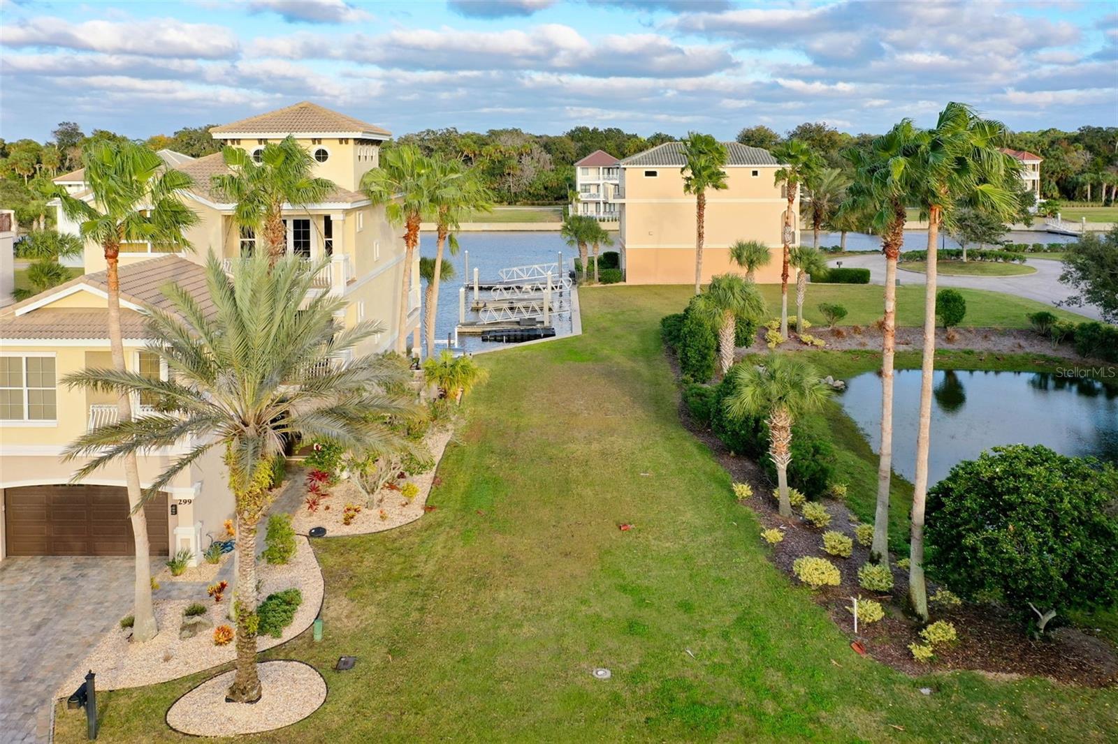 Best priced lot in this Intra-coastal gated community of Yacht Harbor Village. Build with one of the preferred builders on your own time frame. Park your boat right outside your back door with a three-minute ride to the Intra-Coastal Waterway. The Association amenities include clubhouse, pool, tennis courts, fitness room, maintenance and a guard at the gate. The Marina inside the community can accommodate boats up to 100'. With an optional membership to the Hammock Beach Club, you can enjoy world class golf and fine dining. The quarterly HOA fee also includes lot maintenance. This lot is one of the few larger lots with 5,499 square feet. Survey is attached and is the last photo.  Why build anywhere else. Come see just how beautiful life can be.
