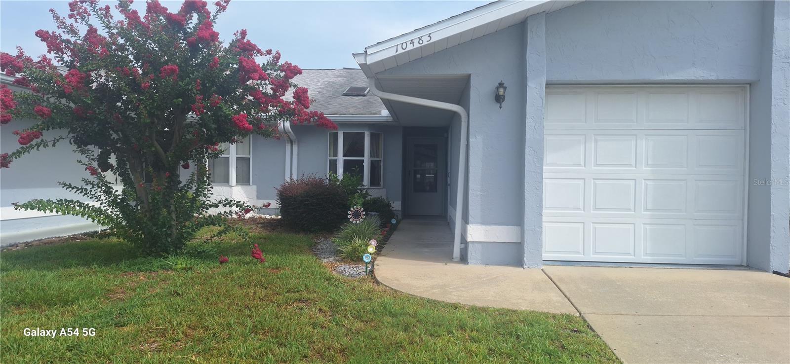 New to the market! Trade lawn chores for pool days, porch mornings, and weekends spent exploring Marion County. This inviting two-bedroom, two-bath villa in gated, all-ages Oak Trace Villas offers 1,090 square feet of comfortable living space, an attached one-car garage, and an enclosed lanai ready for coffee at sunrise, a creative studio, a home office, or a quiet place to unwind.

The HOA includes lawn care, twice-weekly trash pickup, Spectrum internet with select premium channels, and access to the community pool, giving you fewer errands, less upkeep, and more time to enjoy where you live.

Marion County brings the outdoors close to home, with sparkling springs, kayaking, fishing, golf, parks, walking and biking trails, local restaurants, shopping, and medical facilities all within convenient reach. State Road 200 and I-75 also make work, travel, and Central Florida day trips easy.

Whether you are buying your first home, creating a Florida home base, or looking for a lock-and-leave retreat, this villa offers a comfortable way to own your space without letting homeownership take over your life.

Fresh to the market and ready to be discovered! Schedule your private showing before someone else claims the easy Florida life.