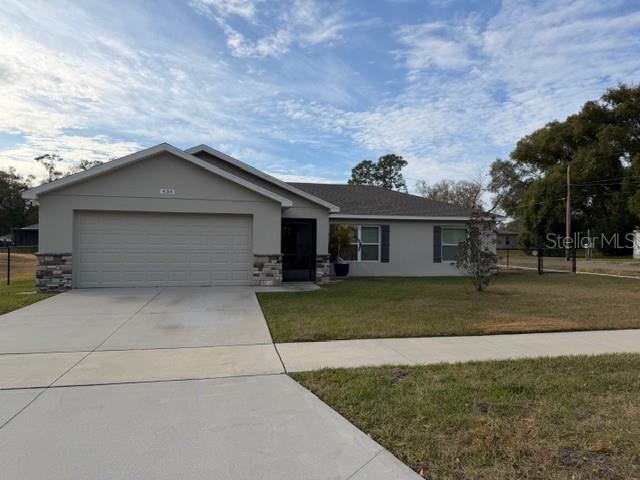 This amazing home is only a couple years old and is still just like NEW..... with 3 bedrooms, 2 baths, 2 car garage with opener, covered screen porch, and on a corner lot... this home is sure to fit your needs.   The home offers so many designer features; such as deco ceramic tiles, quartz countertops, stainless appliances, wood plank floor tile throughout, huge mud room, modern paint scheme, and so much more..... not to mention this home is also and energy star rated home! A programable thermostat, double pane windows, radiant barrier, energy star water heater, appliances, and ac unit just to name a few.....Plus its just minutes from HWY98, I4, HWY33, Downtown Lakeland, Bonnet Springs, and all the shopping and dining Lakeland has to offer.