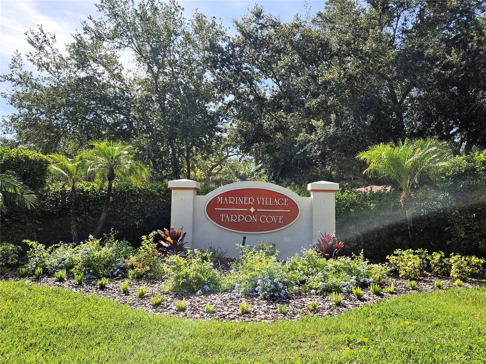 Welcome to Tarpon Cove, a highly desirable Gulf-front, maintenance-free community in beautiful Tarpon Springs, where this exceptional furnished 2-bedroom, 2-bath first-floor condo offers the perfect blend of comfort, coastal charm, and effortless Florida living. Positioned high enough that it has never flooded despite its close proximity to the Gulf, this beautiful residence features wood flooring in the living room, an inside laundry area, a well-cared-for interior that reflects true pride of ownership, newer hurricane-impact windows, and newer A/C for added peace of mind. Relax and unwind with spectacular pond views, then step outside to discover the incredible lifestyle that makes this all-ages community so special, with private pools, tennis and pickleball courts, scenic private trails where you can enjoy unobstructed views of the Gulf of Mexico, watch unbelievable sunsets, and take in the beauty of the water any time of day while surrounded by local wildlife and serene spots to pause, rest, and savor the moment, plus charging stations conveniently located throughout the community for residents to use. Residents also enjoy complimentary access to multiple designated BBQ areas, a massive clubhouse available for private parties, and the option to rent a boat slip at the privately owned marina for easy Gulf access. From peaceful sunset strolls along the water to poolside afternoons in the Florida sunshine, every day feels like a getaway. Beyond the gates, Tarpon Springs offers year-round events, local and state parks, nearby favorites like Sunset Beach and Fred Howard Park, biking on the Pinellas Trail, kayaking or boating on Lake Tarpon, the Bayou, the Anclote River, or the Gulf of Mexico, plus the charm of downtown markets and the world-famous Sponge Docks. This is more than a condo, it is the furnished coastal retreat and lifestyle you have been dreaming of.
