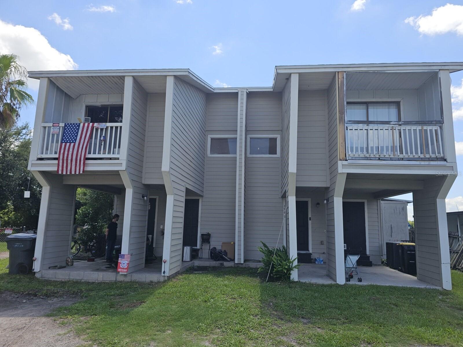 Attached duplex-style townhome investment opportunity in Lakeland, made up of 1106 and 1108 Country Club Ln being marketed and sold together but on separate lots (and utility meters)!  The front porch is covered and a large utility closet near the front door stores water heater, hvac, and space for more!  Each side is a 2 bedroom / 2 bath with massive master bedrooms, cozy living rooms, and a spacious layout overall.  Each unit has lake views out the back and separate yards with sliding doors leading to decks out the kitchen.  Laundry hookups are located upstairs.  1106 Currently tenant occupied through 10/31/2026 and 1108 through 01/31/2027.  Total monthly rents currently are $2,840/month with room for growth.