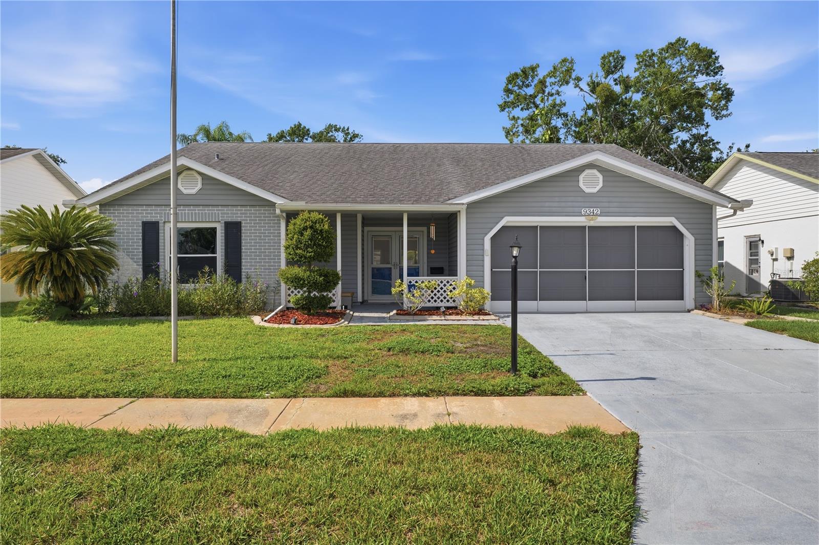 Welcome to your next chapter in the highly desirable 55+ Heritage Lake community! This beautifully updated 3-bedroom, 2-bathroom home with a 2-car garage is one of the few three-bedroom models in the neighborhood and is situated on a quiet, low-traffic street.
Step inside to discover a bright, open floor plan designed for comfortable everyday living and effortless entertaining. Brand-new engineered hardwood flooring extends throughout the living room, dining room, and bedrooms, creating an warm cohesive flow. The kitchen features granite countertops, stainless steel appliances, a spacious pantry, and an abundance of workspace. You will also find granite countertops in the  thoughtfully designed, beautifully maintained bathrooms. Modern lighting and ceiling fans complement the home's contemporary style.
Enjoy peace of mind with major recent improvements, including a new roof (2021), new tankless water heater (2023), and new A/C system (2025). Additional upgrades include new double-pane front entry doors, energy-efficient double-pane windows, and a screened garage door that allows fresh air and natural light while keeping our friendly Florida insects out.
Enjoy your morning coffee or unwind in the evening on the private rear patio with no immediate rear neighbors, offering a peaceful setting with views of the nearby water basin and tons of local wildlife.
Heritage Lake offers an exceptional active-adult lifestyle with a heated pool, hot tub, tennis, pickleball, shuffleboard, bocce ball, horseshoes, billiards, organized clubs, fitness activities, social events, and much more. The community's low HOA fee makes this wonderful community even more attractive.
Conveniently located near Mitchell Ranch shopping and dining, medical facilities, golf courses, Gulf Coast beaches, and less than an hour from Tampa International Airport, this move-in-ready home combines modern updates, low-maintenance living, and an outstanding location. Schedule your private showing today!