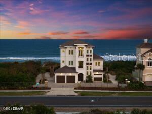 Unicorn Alert! Offered for sale for the very first time is this newly constructed (2023) custom built 4 bedroom, 4 bath, 3 car garage direct oceanfront home in Hammock Dunes Clusters. As you approach the pavered driveway, you will find coquina stone and wrought iron fences creating an elegant buffer from A1A. The home has two separate garages which in total, hold three vehicles. Double doors open to a large receiving foyer complete with elevator and access doors to both conditioned and unconditioned storage areas. Ascend the stairs with hardwood handrails to the second floor and be greeted with jaw-dropping views of the beach and Atlantic coastline. The great room has a linear glass fireplace, beam-in-tray ceiling and three 8' x 4' windows that flood the home with natural sunlight. The open floor plan flows seamlessly into the kitchen & dining room that together, combine to create an off-the-charts ''WOW FACTOR!'' The kitchen features a center island with farm sink, a custom hood

above a five burner glass cooktop, a built-in oven and microwave, dishwasher, beverage cooler and upper cabinets that extend to the ceiling to maximize storage. Tucked neatly into one corner is a door to the separate butlers kitchen containing open shelving, base cabinets with soft-close drawers, pantry, second sink and dishwasher. The dining room contains a built-in window seat with additional storage and glass doors that open out onto the covered oceanfront balcony. Completing the remainder of the second floor are two sizable guest bedrooms which share a full bathroom with tub/shower combination, a sitting area with granite-topped beverage station, huge laundry room with sink and ample cabinets, and finally, a half bathroom with pedestal sink. Elegant touches include plantation shutters on every non-oceanfront window. The third and top-most floor can be reached via elevator or hardwood stairs featuring wood and wrought iron balustrades. The primary suite, accessed via solid French doors, features a second, linear glass fireplace in a private sitting room, walk-in closet, cathedral ceilings with beams and sliding glass doors that open onto the second covered oceanfront balcony. The primary bathroom features a built-in makeup vanity, dual sinks, a corner glassed-in spa shower with bench and a separate soaking tub. This floor is also home to a fourth bedroom featuring an ensuite bathroom with walk-in glass shower. Exit the elevator landing/sitting area to your private sunset balcony. Whether you wish to sit on one of the many balconies to watch the rolling surf, or jump on your surf board to head out into the water via your private dunewalk, this home calls to all lovers of a sun & sea lifestyle.
This home is also available for possible annual or seasonal lease.