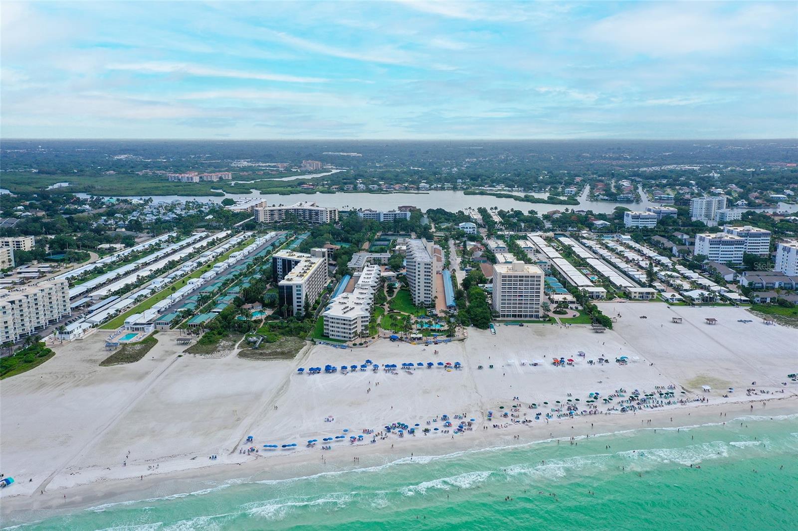 TOWER RESIDENCE IN SARASOTA SURF AND RACQUET CLUB. 
2BR/2BA in a Gulf & Beach Front Community  – Resort Style Amenities – Proven Vacation Rental – Move In Ready - Enjoy the island lifestyle in one of Siesta Key’s most desirable beach front communities, located directly on Crescent Beach, the powdery white sand shoreline that makes Siesta Key world-famous. 

This beautifully appointed 4th-floor residence in the sought-after Tower Building offers convenient access to the pool and beach, making it a favorite for owners and vacation guests alike. Expansive windows invite natural light and offer a Gulf view, creating a bright and inviting coastal retreat.

Interior highlights include: Luxury vinyl plank (LVT) flooring throughout; Granite kitchen countertops; Split-bedroom floor plan for added privacy; Open living and dining areas designed for relaxed beach living.

Residents and guests enjoy private access to Siesta Key’s Crescent Beach along with exceptional on-site amenities: Two heated swimming pools; Beachside & poolside BBQ grills; Fully equipped fitness center; Four pickleball courts; Three tennis courts (including two Har-Tru clay courts - the only resort clay courts on Siesta Key); On-site rentals for cabanas, tents, umbrellas & beach equipment. 

With a three-night minimum rental policy and professional on-site rental management, this condo offers exceptional opportunity in one of Siesta Key’s most recognized beachfront communities. Ideal as a personal beach retreat, full time residence or a high-demand vacation rental. 

Offered fully furnished, ready for immediate enjoyment, this residence delivers the Siesta Key lifestyle.
