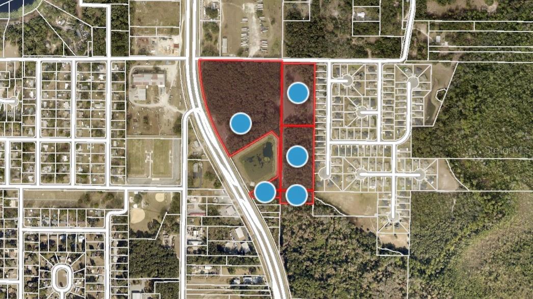 Ready for Commercial & Multi Family Development 26+/- Acres Zoned PUD ( Planned Unit Development) City of Fruitland Park, City Utilities available, Potential Signalized entry into property, 30,000 Avg Trips per Day, Over 1,000+/- Ft on US Hwy's 441-27 & 845'+/- Ft on Register Rd. Alt Key # 1287286, 1287219, 1287111, 1170214 & 3816275. Commercial Area could be developed as Multi-Family, ALF, ILF, Storage, General Commercial, offsite water retention available . Located in the Heart of Central Florida, near The Villages, I-75, Florida Turnpike, US Hwy 27 & US Hwy 441, 1 Hour from Orlando, Beautiful Site for Development, Minutes to World Class Golfing & Fishing on the Harris Chain of Lakes. Review attached conceptual' s. All information is believed correct and accurate but not guaranteed or warranted and subject to change without notice