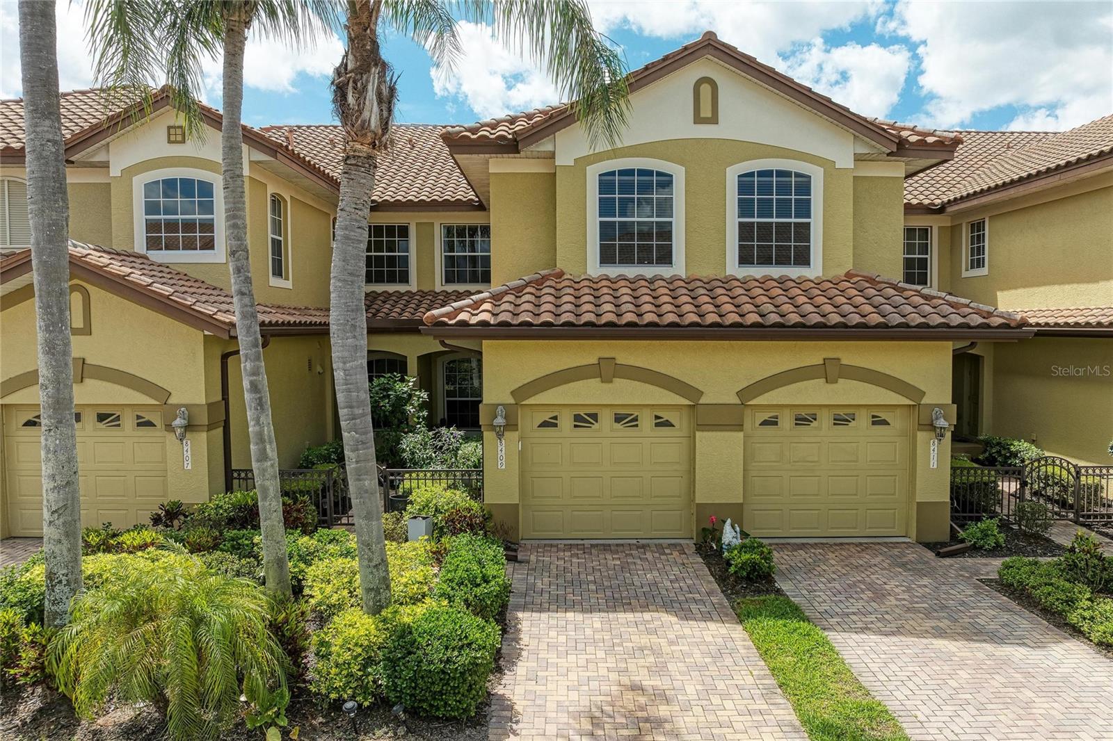 Welcome to your Florida Paradise! This Luxury Villa-Style 2-Bedroom, 2-Bath + Den, Ground-Floor Condo is located in the highly sought after Gated Community of Miramar in Lakewood Ranch, offering serene water views in a premier location. From the moment you arrive, you’re welcomed by a charming Mediterranean-style villa featuring tile roofs, a private front courtyard, and an attached one car garage, setting the tone for this warm and inviting home. Step inside to an open floor plan filled with natural light, high ceilings w/ crown molding, beautiful architectural details, and a seamless flow throughout. The expansive living room is perfect for relaxing and flows effortlessly into the dining area, ideal for entertaining friends and family. Just off the living room and primary suite, step out to enjoy your morning coffee or unwind in the evening on the screened lanai overlooking the tranquil lake and local wildlife. The spacious kitchen features a breakfast nook with water views, granite countertops, soft-close wood cabinetry with pull-outs, a gas range, and stainless steel appliances, perfect for both everyday living and entertaining.
The main living areas are light & bright showcasing beautiful tile flooring throughout. The owner’s suite offers a peaceful retreat with two large walk-in closets, dual vanities, a private comfort-height toilet room, a spacious walk-in shower, and a relaxing garden tub to unwind after a long day. Additional highlights include updated lighting, a brand new Trane A/C unit (March 2026), tankless hot water heater, fire sprinkler system, two new toilets (March 2026), and select furnishings that could remain for the Buyer’s convenience. Miramar offers low HOA fees and exceptional amenities, including a heated pool and spa, clubhouse with full kitchen, fitness center, conference room, outdoor BBQ area, and a scenic dock with gazebo, perfect for sunsets and bird watching. Ideally located just minutes to I-75, UTC shopping and dining, Lakewood Ranch Main Street, the new Waterside Place, and easy access to Sarasota and Tampa airports. Plus, you’re only 30–45 minutes from the world-renowned beaches of Siesta Key, Longboat Key, and Anna Maria Island. Golf enthusiasts will appreciate the abundance of nearby public and private courses to choose from.
Whether you’re looking for a primary residence, a second home, or investment opportunity, this maintenance-free lifestyle offers it all. This is your chance to enjoy the lifestyle you’ve been dreaming of, don’t let it pass you by!
