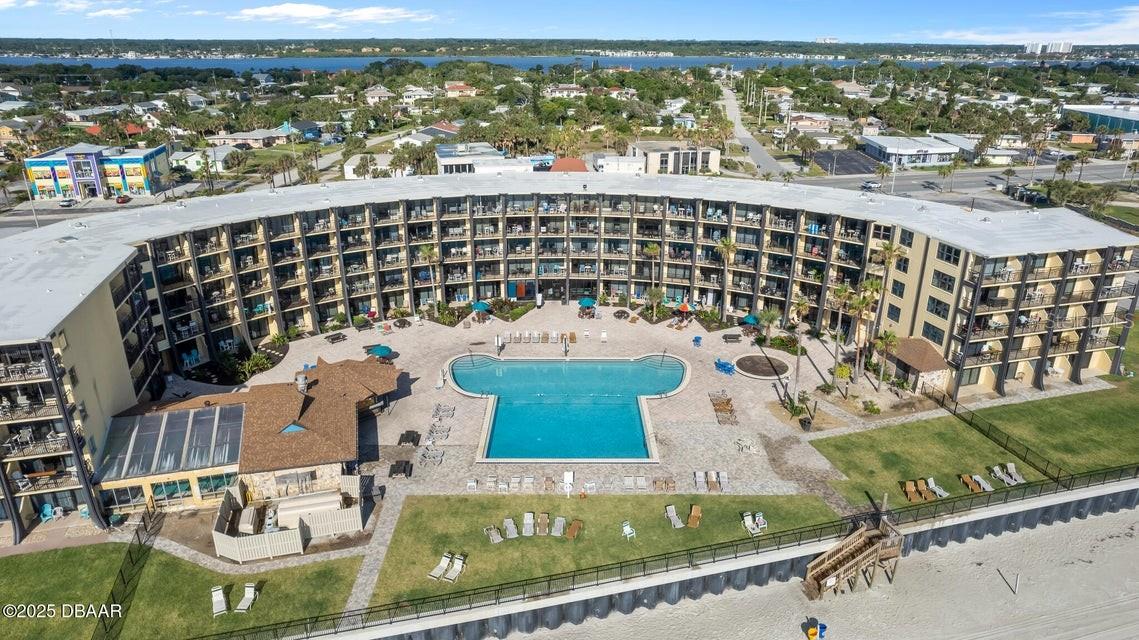 Charming oceanfront studio with newer impact windows and stunning views of the Atlantic. Lovingly used as an owner’s retreat, this unit is in excellent condition and thoughtfully updated throughout. The space features a high-quality king-size bed, two comfortable recliners, attractive tile flooring, a convenient kitchenette, and tasteful finishes that make it both inviting and functional. Offered fully furnished, it’s truly turn-key—ideal as a weekend escape, vacation retreat, or income-producing condo.

The Hawaiian Inn is a beloved, iconic beachfront destination that has welcomed generations of returning guests. Enjoy the on-site tiki bar known for great burgers, fish sandwiches, and ice-cold drinks, unwind by the large oceanfront pool, or relax year-round in the heated indoor pool. The welcoming lobby includes a gift shop and game room, adding to the classic resort-style experience. Perfectly located near the Speedway, shopping, and dining, this is a rare opportunity to own your own slice of oceanfront paradise.