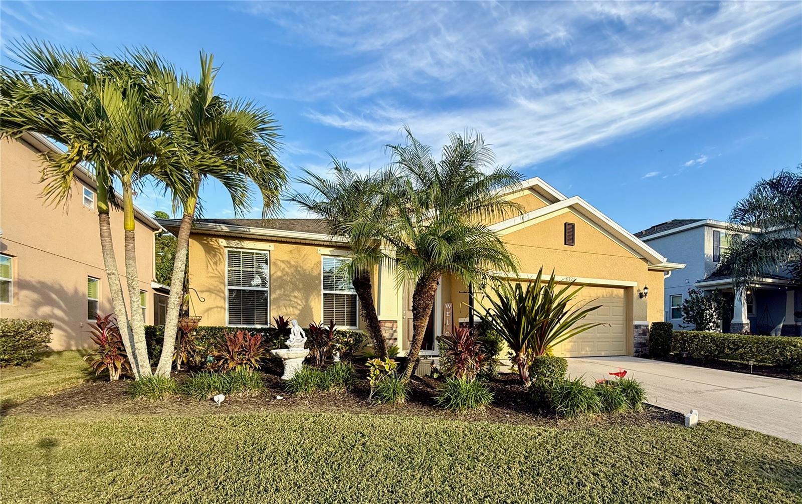 Experience refined Florida living at 6121 35th Ct E, Bradenton, FL — a stylish retreat tucked at the end of a quiet cul-de-sac in one of Bradenton’s most convenient pockets. This beautifully cared-for home greets you with soaring ceilings, abundant natural light, and an open-concept layout designed for both comfort and entertaining. The kitchen offers generous counter space and a seamless connection to the main living areas, creating a natural gathering spot. Step out to the screened lanai and take in serene views of mature trees and lush greenery — a perfect backdrop for morning coffee or evening wine. The split-bedroom design ensures privacy, with a spacious primary suite offering a peaceful escape. With charming curb appeal, a two-car garage, and close proximity to University Town Center (UTC) where you can shop and dine and also enjoy the Gulf Coast beaches, this home strikes the perfect balance of tranquility and accessibility. It’s move-in ready and waiting to elevate your lifestyle.