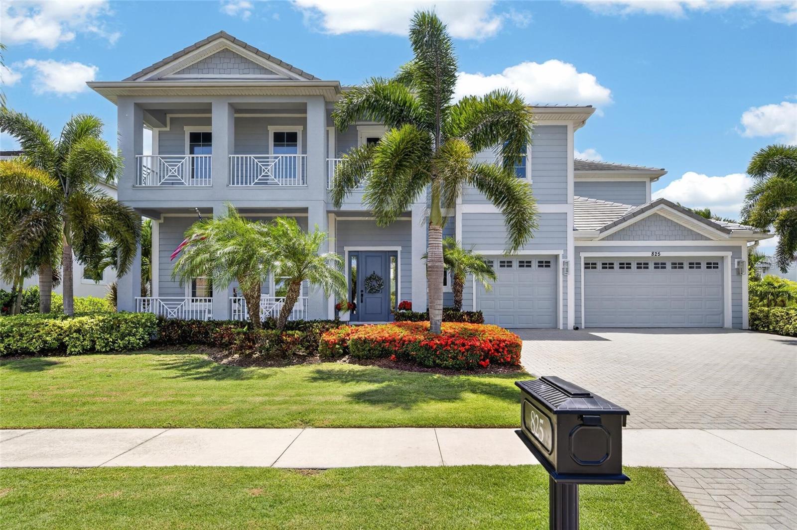 825 Manns Harbor Drive | 5 Bedrooms | 4.5 Bathrooms | 4,648 Sq Ft | Waterfront | MiraBay

There is a specific stretch of MiraBay that residents wait years for the chance to call home. Bordered by the Wolf Creek Nature Preserve and situated on a rare 100-foot-wide waterfront lot lined with mature palms, 825 Manns Harbor Drive offers a combination of privacy, water frontage, and protected views that is difficult to find anywhere else in the community. The peaceful setting, long water views, and natural backdrop create an environment that simply cannot be replicated.

The floor plan is thoughtful from front to back. An oversized office sits at the front of the home, set apart from the main living areas and ideal for working from home or quiet reading. The chef's kitchen features solid wood cabinetry, quartz countertops, a gas cooktop with custom hood, double ovens, stainless steel appliances, and a custom-built great room bar. The oversized center island is complemented by illuminated cabinetry and a true butler's pantry complete with a vegetable sink, and walk-in storage. The primary suite is located on the main level and features a giant walk-in shower, dual vanities, and a custom closet organization system. The remaining bedrooms are generously sized with large closets and dedicated bath access, while custom wall details are woven throughout the home. Storage has been thoughtfully incorporated at every turn.

Upstairs, the home opens up in unexpected ways. The full-sized family loft is framed by nearly wall-to-wall picture windows capturing expansive views across the MiraBay lagoon. A dedicated movie theater room with full surround sound creates a private entertainment space for family and guests. The second-floor balcony faces west and is perfectly positioned to enjoy sunsets over the preserve each evening. The home is wired for smart home functionality throughout.

Outside, more than 700 square feet of covered outdoor living and entertaining space extends the home's living area. The screened lanai surrounds a heated pool and spa overlooking deep water views and includes a dedicated pool bath for convenience. The composite dock is equipped with water, electricity, and a 13,000-pound  lift. Additional features include true wood flooring, smart technology, surround sound, a custom stair railing, a three-car garage, and a tile roof. The HVAC system was serviced in May 2026.

MiraBay's HOA is approximately $190 yearly and includes two heated pools, a 24-hour fitness center, tennis courts, pickleball courts, basketball courts, a kayak launch, and a full calendar of community events. Residents can access the MiraBay Shopping Plaza by golf cart. The community is elevated, and flood insurance rates are often lower than many surrounding waterfront neighborhoods.
What the Seller Loves

"What I will miss most is the morning. Sitting on the lanai with a cup of coffee, the preserve behind us and the water in front of us, there is no noise except the birds and the occasional boat heading out to the bay. The palms give this property a feeling that is completely unique. We chose this location within MiraBay very deliberately, and it delivered everything we hoped it would. The outdoor kitchen made every weekend feel like an event, and the boat lift meant Tampa Bay was never more than a few minutes away. Watching the sunset over the preserve from the balcony never got old. This home was built to be lived in fully, and we did exactly that."