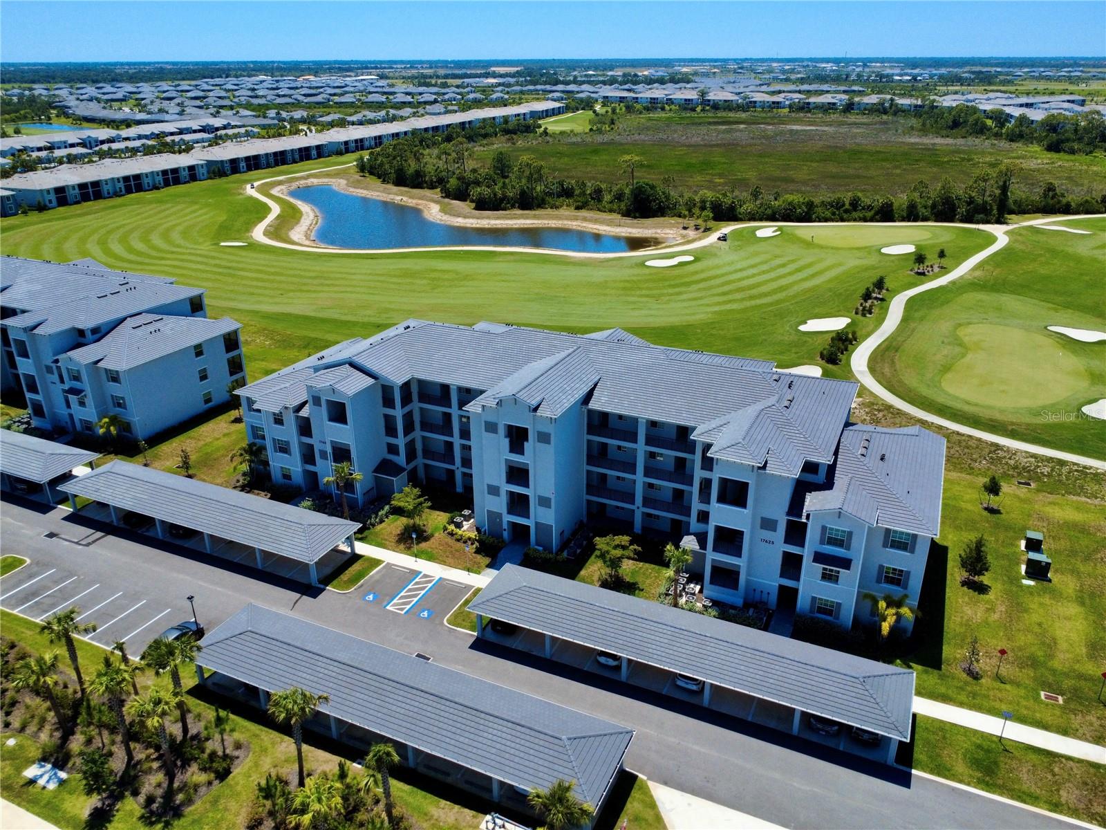 TURNKEY FURNISHED 3rd-floor condo with rare GOLF MEMBERSHIP (two included)! Perched above the signature 5th hole, this residence offers unobstructed panoramic views of the 5th & 6th holes, beautiful landscape and lush preserve—one of the most desirable vantage points in Wellen Park Golf & Country Club. The 3rd-floor location provides exceptional privacy, peace, and natural light throughout the open-concept living area. Easy elevator access with a storage unit right outside the front door. Interior features include tile flooring in main living spaces, brand-new carpet in bedrooms, a spacious primary suite with walk-in closet, and an en-suite bath with quartz counters and tile shower. The guest bedroom is conveniently located near a full bath and away from the primary bedroom—ideal for visitors. Residents enjoy resort-style amenities: an 18-hole championship golf course, resort pool with tiki bar, tennis, pickleball, bocce, fitness center, dog park, and a new clubhouse coming in 2027. Minutes to Downtown Wellen Park, dining, shopping, an 80-acre lake, trails, and Gulf beaches. Lennar is completely sold out of Golf Terrace condos, making this a rare opportunity to secure a 2025 built unit with a membership. 
A rare chance to own a top-floor golf condo with membership in one of Florida’s most talked-about master-planned communities. Schedule your showing today!