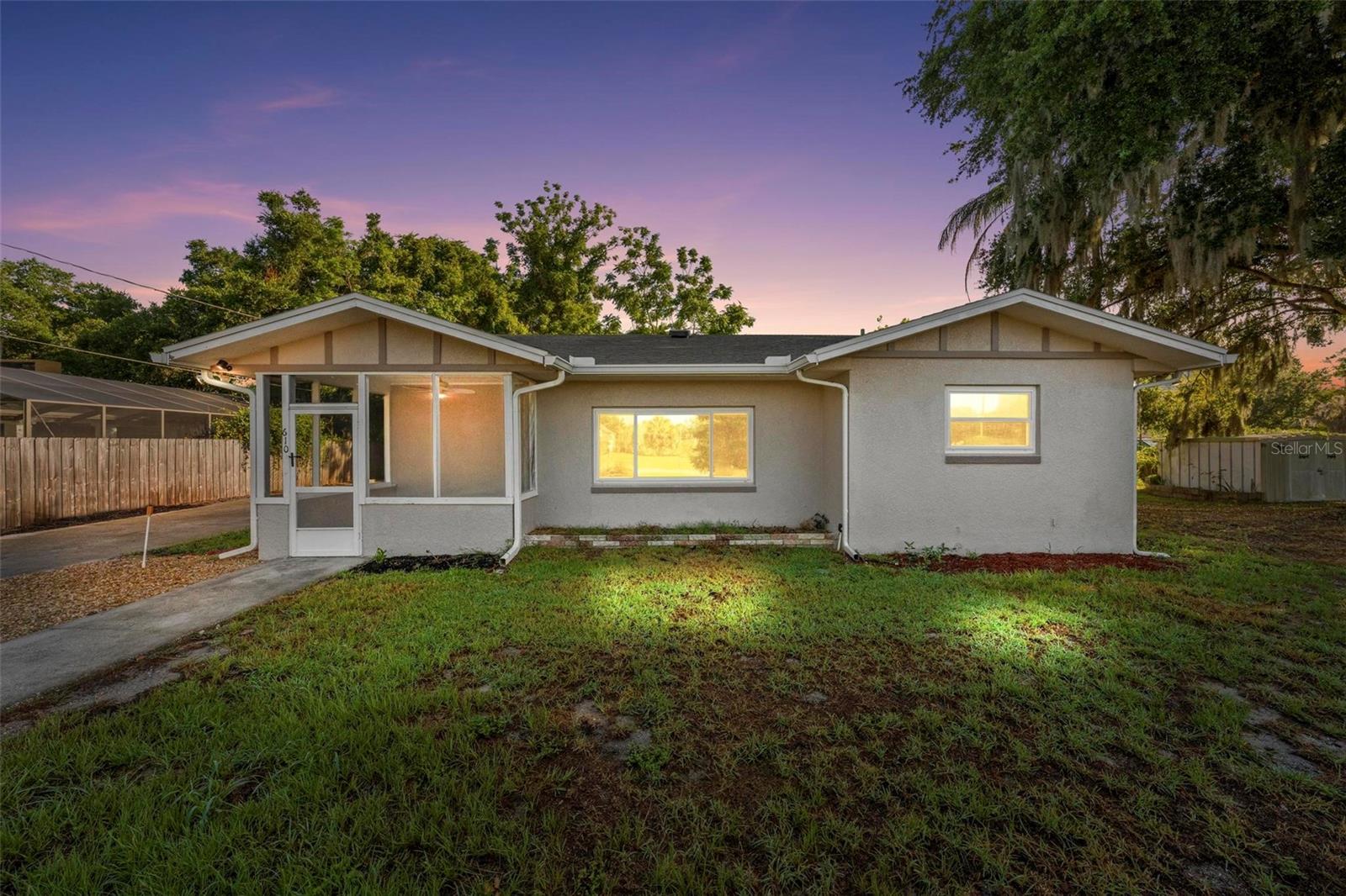Fully remodeled 3/2 within walking distance to downtown Tavares. Large corner lot with mature trees. New roof in 2023. New HVAC in 2018. Updated kitchen includes oversized refrigerator and large wall oven. Spacious open floor plan with screened front porch. Oversized 1 car garage with built-in shelving. No HOA.