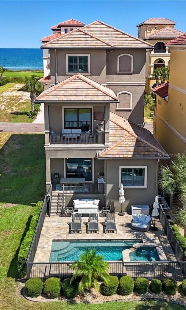 Walking distance to the Hammock Beach!!! 

Experience resort-style living at 355 Ocean Crest Drive, an elegant 3-story residence in the exclusive Hammock Beach community. Offering nearly 4,000 sq ft of refined living space, this home blends timeless design with modern comforts and breathtaking views.
Inside, you’ll find 3 bedrooms, 3.5 baths, an elevator, and open living areas designed for both entertaining and relaxation. The top-floor master suite includes a private sitting area, a wet bar, a bonus room to be used as a home office or as you wish, spacious walk-in closets, and serene ocean and golf course views. 
Step outdoors to your private paradise: a heated saltwater pool with spa, summer kitchen, and multiple covered patios perfect for al fresco dining and sunset gatherings. Overlooking the Jack Nicklaus–designed golf course and with lake frontage, the home offers a rare combination of golf, water, and coastal living. Best of all, it’s just a short walk to the beach, oceanfront dining, and local restaurants, which makes every day feel like vacation.
Additional highlights include a 2-car garage, hurricane shutters, block/stucco construction, and HOA-maintained grounds. Residents enjoy direct access to the beach, and if desired, may enroll in Hammock Beach Club membership options: Full 2 Golf courses option (including the well-known Ocean Course, also known as Jack Nicklaus Ocean Course) + Beach Club or Beach Club Social only. Membership is required for use of the resort amenities and golf course. Details available upon request.

This is more than a home — it’s a coastal retreat designed for those who seek the ultimate Florida lifestyle.
