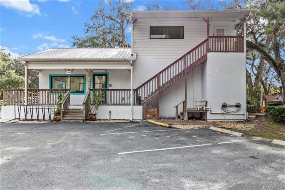 Residential/Commercial property in the heart of Homosassa NEVER FLOODED and OWNER FINANCING AVAILABLE! This golf carting community is known for its world class fishing and tourism! Upstairs living quarters is currently being used for a VACATION RENTAL that is booked out to March 2025. With this property being zoned CLC the business opportunities are endless. Building is handicap accessible with ramp, rails, and bathroom. Upstairs has full kitchen and bathroom that has been recently renovated. Don't miss this chance to own a prime piece of Homosassa for your starter or existing business! NEW AC 2026.