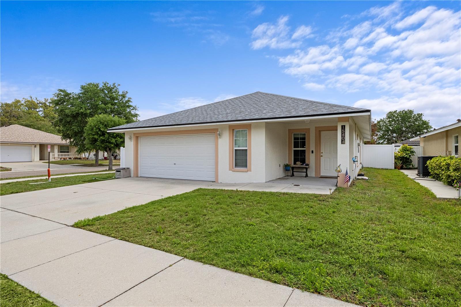 LARGE PRIVATE BACKYARD with 6FT PRIVACY FENCE home. This well-maintained 3 bedroom, 2 bath home sits proudly on a desirable large corner lot and is designed for both comfort and functionality. Step inside to find an open floor plan with durable vinyl flooring throughout the main living space areas- perfect for easy maintenance and everyday Florida living.  The kitchen features sleek stainless steel appliances, making it a great space to cook, gather, and entertain. The main bedroom has a large walk in closet and main bath with tub and shower. The home comes with blinds on all windows and fans in every room. The ROOF was REPLACED IN 10/2025, WASHER REPLACED 2023, STOVE REPLACED 2026, DISHWASHER REPLACED 2026, REFRIGERATOR 2025.VINYL FLOORING IN MAIN AREAS IN 2023. The home has been lovingly cared for and it shows in every detail. Enjoy outdoor living in your spacious, private backyard--fully enclosed with a PRIVACY FENCE, ideal for pets, entertaining, or simply relaxing in your own peaceful retreat. This home is meticulously clean and well loved with a very large backyard with a private fence Whether you are a full-time resident, seasonal homeowner, or investor, this ranch home offers the perfect blend of location, condition, and lifestyle. With easy access to beaches, shopping, dining, and major travel hubs, this is Florida at its best.