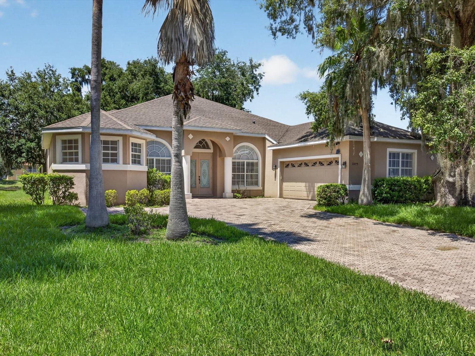 Virtually Staged. Well cared for home in the sought-after Oak Hammock Preserve community. This spacious 4-bedroom, 3-bathroom home offers 2,768 square feet of thoughtfully designed living space, combining comfort, functionality, and beautiful outdoor water views. As you enter the home, you'll find a versatile den just off the foyer, perfect for a home office, study, playroom, or flex space to fit your needs. The open-concept layout features generous living and dining areas filled with natural light, high ceilings creating an inviting atmosphere for both everyday living and entertaining. The spacious kitchen sits at the heart of the home overlooking the main living area, with views of the water and serene surroundings. Kitchen offers ample cabinet and counter space, making it the ideal gathering place for family and friends. The private primary suite provides a relaxing retreat with his and her closets and en suite bathroom complete with his and her vanities soaking tub and full shower with standing wall. Three additional bedrooms creates flexibility for guests or family members. A convenient feature of the home is the third full bathroom located just inside the rear entrance, providing easy access from the backyard and outdoor living areas. Step outside and enjoy the peaceful setting as the home overlooks serene water views and community walking trails, creating a tranquil backdrop for relaxing mornings and evening strolls. Residents of Oak Hammock Preserve enjoy access to community amenities, including a swimming pool and playground, while benefiting from a convenient location near shopping, dining, schools, major roadways, and Central Florida's world-famous attractions. This beautiful home offers the perfect blend of space, versatility, and scenic surroundings in one of Kissimmee's desirable communities. Don't miss the opportunity to make it yours!