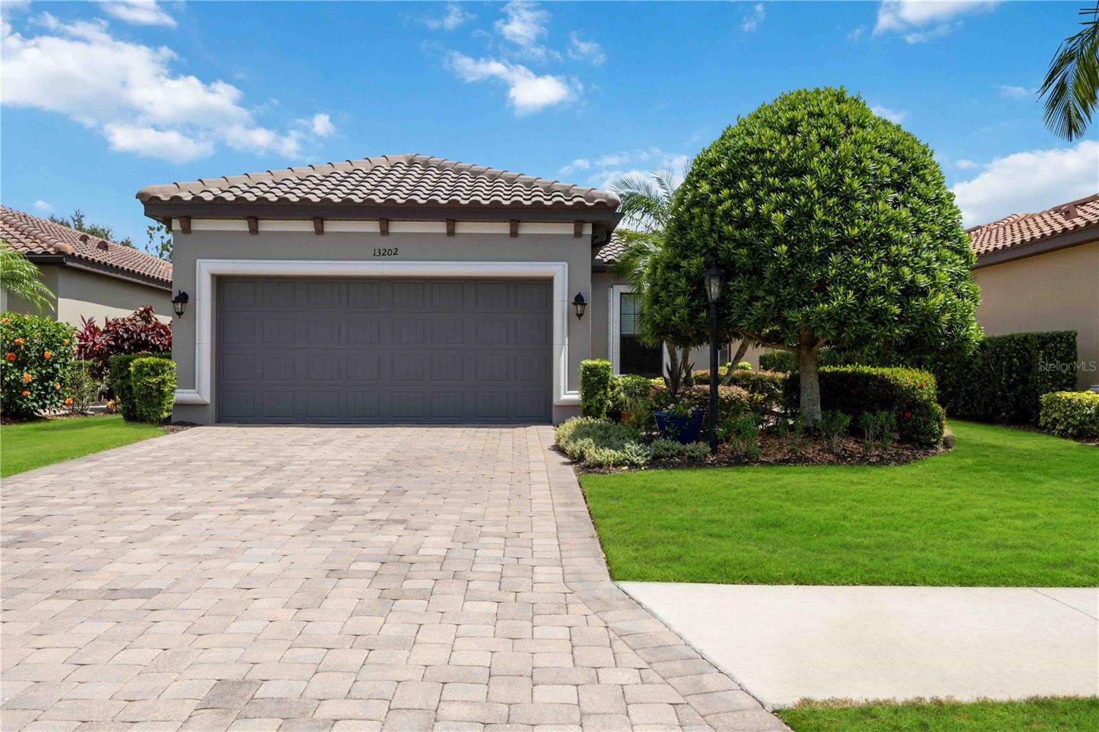 Discover the perfect balance of comfort and community in this maintenance-free, single-family pool home at Esplanade Golf & Country Club, one of Lakewood Ranch’s most sought-after communities. This stunning 2-bedroom, 2-bathroom home also has a versatile den, ideal for a home office, library, or even a third bedroom. Enjoy a vibrant, healthy lifestyle with access to 6 lighted Har-Tru tennis courts, 8 lighted pickleball courts, two state-of-the-art fitness centers, and a full-service spa offering massages, facials, and salon services, and "pay-to-play" golf available to non-deeded members on the Chris Wilczynski-designed course. Indulge in dining at the Barrel House Bistro or savor casual poolside bites at the Bahama Bar. With three resort-style pools including a resistance pool, two dog parks, and dozens of resident-driven clubs like book clubs, cycling groups, and mahjong, every day feels like a getaway. The open floor plan seamlessly integrates the living, dining, and kitchen areas. Natural light pours through large sliding doors, inviting you to the screened-in lanai and private pool, a perfect spot for entertaining or soaking up the Florida sunshine year-round. The light and modern kitchen is a chef’s delight, boasting a gas stove, stainless steel appliances, abundant counter space, and ample cabinetry for all your culinary needs. Retreat to the expansive primary suite, complete with room for a king-sized bed and additional furnishings. The luxurious ensuite bathroom offers dual vanities, a walk-in shower, and a generous walk-in closet for ample storage. The inviting guest bedroom provides comfort and privacy, with easy access to the second bathroom. Recent updates include a NEW A/C unit (June 2024) and a NEW dishwasher (2025). This popular Roma floor plan by Taylor Morrison is perfectly sized for a “lock & leave” lifestyle, with the HOA providing lawn mowing, tree/shrub care and irrigation. Schedule your private tour today!