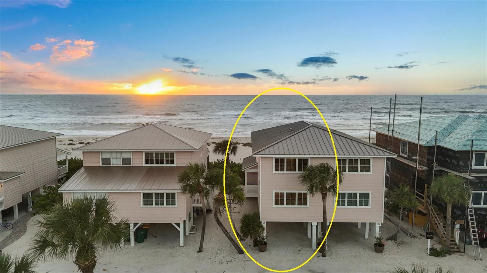 One or more photo(s) has been virtually staged. Newly Constructed Beach Front 3-Bedroom, 3-Bath Gulf-View Townhome
Experience luxury coastal living in this brand-new, custom-built townhome! Beginning with engineer-approved original pilings, the home was rebuilt in 2025 with 6-inch exterior framing, ½” sheathing, cement plank siding, foam insulation, Marvin Signature Coastline windows and doors, and a standing seam metal roof—ensuring superior strength, energy efficiency, and durability. Step inside to an open-concept living, dining, and kitchen area, all showcasing stunning Gulf views. Enjoy your morning coffee and spectacular sunsets from your private waterfront open lanai. The interior features tile and wide plank engineered hardwood floors and rift-sawn oak custom cabinetry. The chef’s kitchen boasts quartz countertops, matte white GE Café appliances with brushed bronze accents, and a dedicated bar area with beverage refrigerator—perfect for entertaining. The main-level bedroom includes custom built-ins and access to a full guest bath. Upstairs, the Gulf-front primary suite offers custom cabinetry, and a luxurious ensuite bath with dual sinks accented with bronze fixtures. A spacious third bedroom, also with custom built-ins, and features its own private ensuite bathroom. Other features include solid core doors and a whole house carbon and sediment dual water filtration system and tankless water heater.  Over 1,000 additional square feet of covered parking for your car, golf cart and bikes. Every detail has been thoughtfully designed to create a refined coastal retreat just minutes from town, offering quick access to island shops, dining, and community events!